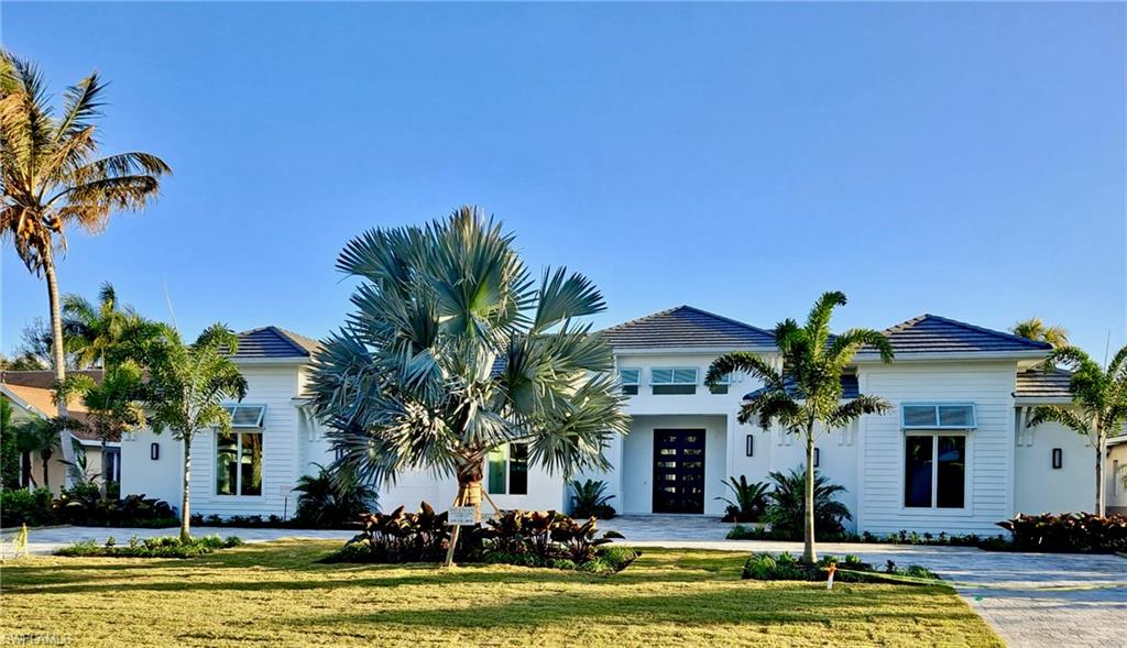 Available immediately, a stunning new construction home that combines timeless elegant design, & highest quality construction. Located in an ideal location within prestigious The Moorings, it is situated on an oversized, sunny south facing lot.  Built by Dillman Construction, one of Naples premier luxury home builders, this elegant Starboard Drive home offers the perfect balance of casual & elegant living on a floor plan that offers both generous open space and privacy. A bright residence full of natural light, this home features wide-plank Legno Bastone European oak floors, extensive molding and custom woodwork throughout. The expansive outdoor area is simply stunning, w/ 45-foot lap pool w/ fountains & spa, outdoor kitchen, open view gas fireplace and lots of yard space for your outdoor activities. Other great features include Sub Zero & Wolf appliances, hidden walk-in pantry, & coral stone pool deck. Private beach access available through the Moorings Property Owner's Association.