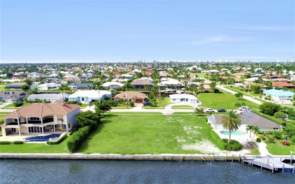 Build your dream home in this dream location on this dream property.  Over sized home site - one half times larger than the others. 150' water frontage and 150'deep.  .52 acres, 22,651 square feet.  Located directly on Marco River offering quick direct access to Gulf of Mexico with unsurpassed, sweeping, open, unobstructed views!