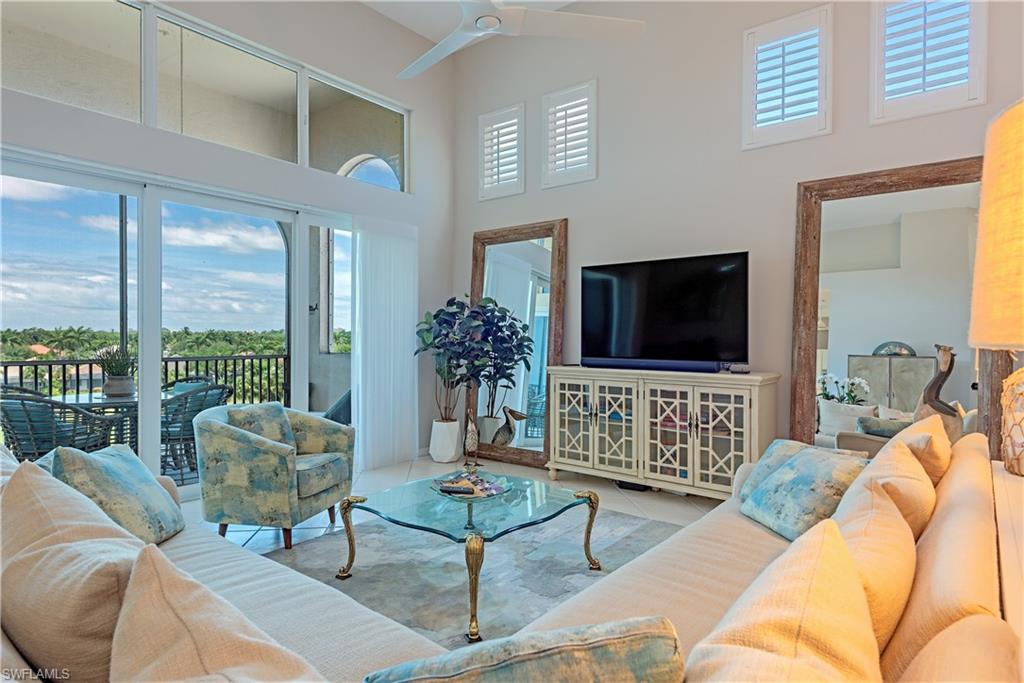 This beautifully updated 3-bedroom condo on the highest floor of Clermont has incredibly high ceilings (12 to 14’).  It has a gorgeous, totally remodeled master bath, nice open floor plan, updated kitchen, screened terrace, and a lovely view of the lake and golf course with spectacular sunsets reflecting off the water.  NOTE: A private 2-car garage is also included.  The Clermont community is conveniently located next to the Pelican Marsh community center and just a short walk to the golf club.  In addition to the pool and club room for Clermont, homeowners also have access to the wide range of amenities and activities of Pelican Marsh (bike paths and walking trails, tennis, pickleball courts, bocce ball, a casual café/bistro, and a health club with state-of-the-art fitness equipment and classes).  Pelican Marsh is in an incredibly convenient location in North Naples (less than 5 minutes to Whole Foods and all the shops and restaurants of Mercato and the beautiful white sandy beach and the Gulf of America. Within the community of Pelican Marsh, there are two private golf clubs (Pelican Marsh and the Bay Colony Golf Club).  Although there is a wait-list to join, the courses provide lovely, serene views for homeowners in several Pelican Marsh communities, especially those residing in the mid-rise condos of Clermont.  See photos.