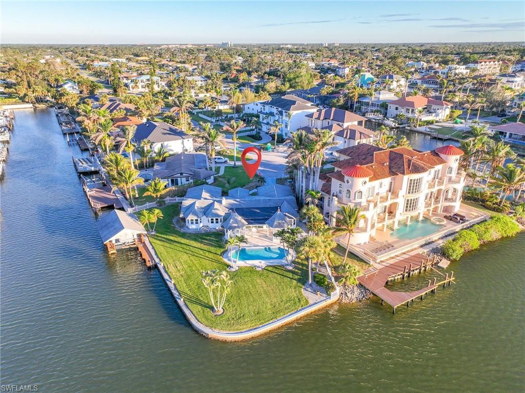 H8270 Welcome to one of the most desirable lot locations in the Conners! This waterfront end corner lot offers one of the longest and widest open water views the area has to offer with no bridge restrictions and gulf access. This a great opportunity to build your dream home in an amazing centralized location. This property is a short bike ride to Naples famous beaches, high end shopping and restaurants in Mercato, a short drive to Waterside Shops, Artis Naples, 5th Ave, and much more. This property is a must see!