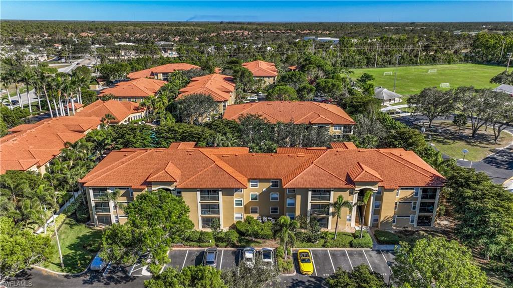 C8241- NEW ROOF 2022 - LOCATION, LOCATION, LOCATION....Tucked away in the heart of Bonita Springs, just off US 41, lies this spacious 3B/2BA condominium nestled within the private, rarely available San Mirage Community. This unit, located close to the newly renovated Community Saltwater Pool, features an open floor plan; a light neutral color palette; new flooring throughout; coveted 3rd bedroom/home office; 3 large walk-in closets and 2 assigned parking spaces. Kitchen features cherry wood cabinets; granite countertops; decorative backsplash; stainless steel appliances and peninsula with breakfast bar. Sliders from living room expand the living area outdoors to a screened lanai catching a colorful western sunset sky. Beautiful custom sunshades enhance the lanai experience perfect for relaxing and enjoying your favorite beverage. Close to RSW International Airport, fine dining and shopping.....your new SWFL home awaits.