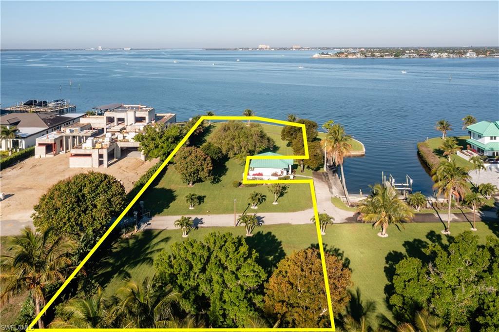 Rare riverfront estate lot in an exclusive double-gated enclave of only 2 residences. This premier approx. 1.3-acre homesite offers 108 ft of direct water frontage, due-west exposure for year-round sunset views, and deep-water access with potential dockage. New seawall in place. Cleared and ready to build with utilities available and a long private drive. Oversized lit allows for potential private sports court. Enjoy expansive long water vistas in a private setting just minutes to Sanibel & Captiva Islands, beaches, shopping, dining, and medical facilities. Exceptional opportunity to create a custom waterfront estate in one of Southwest Florida’s most desirable locations.