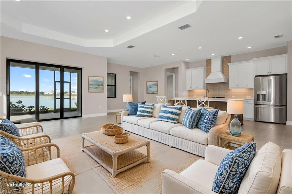 One or more photo(s) has been virtually staged, AI generated or rendered.  Welcome to this RARELY AVAILABLE 3-bed plus den, New Construction, 2.5 bath BRIGHT MEADOW floorplan! This spacious open concept model stuns with expansive views from the screened-in lanai. This property features upgrades galore including designer kitchen finishes with quartz countertops, stainless appliances, 3-car garage, upgraded electrical and plumbing options, and all exterior windows and doors are impact-rated. All electrical for future pool construction is complete as well as pool architectural plans. The den offers flexibility for a home office, extra guests, or a quiet reading space. SkySail is a serene home neighborhood located among 246 acres of sparkling lakes. This beautiful lakeside community offers a variety of resort amenities perfect for connecting with neighbors through outdoor relaxation or exciting activities.Neighborhood features include the lake, tennis, pickleball, trails, fishing pier, dog parks, pickleball, basketball court, fitness center, community pools, lap pool, spa, bocce, playgrounds, and a state-of-the-art community wellness and gathering center. Check out the Virtual Amenities Tour to see this wonderful neighborhood.
One or more photo(s) has been virtually staged, AI generated or rendered.