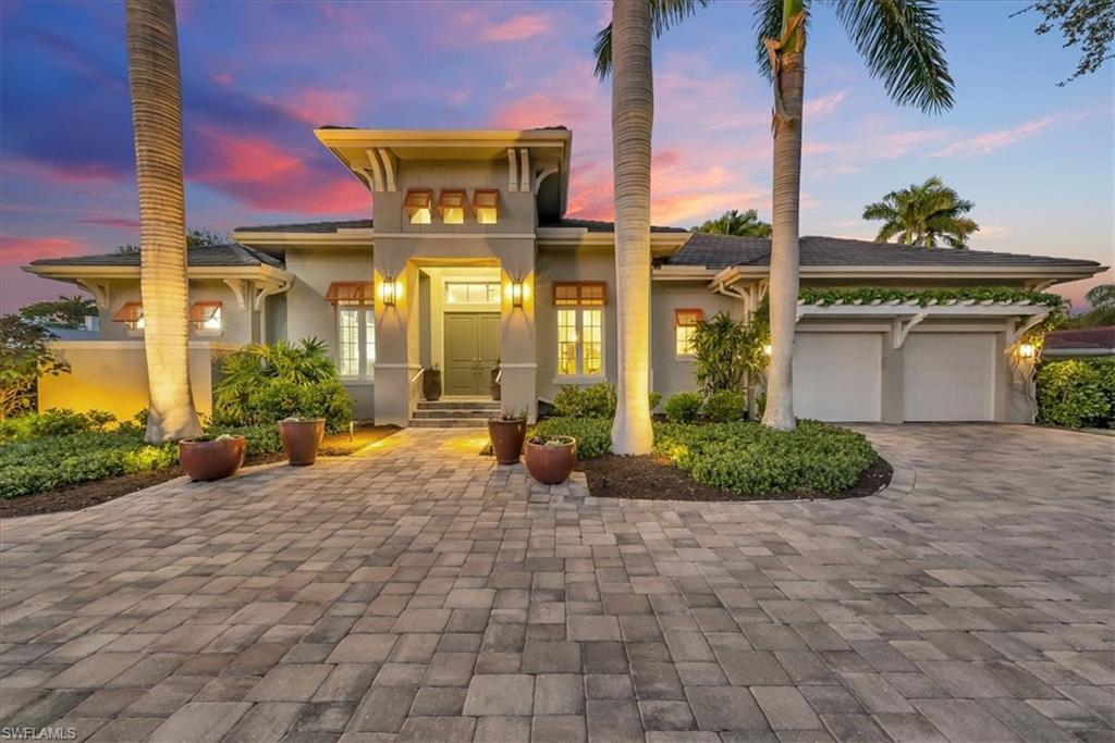 Nestled on one of the Moorings most prestigious streets, step inside 455 Bow Line Dr where timeless sophistication meets modern coastal living. This impeccably custom designed 3 Bedroom + Den, 3 and a half Bath residence delivers an effortless luxury. Rich wood floors, tray ceilings, and a well-designed open floor plan creates a flow for both everyday living and entertaining. The chef’s kitchen features premium Thermador appliances, including a French-door refrigerator, triple combination oven, and built-in wine cooler, complemented by formal and casual dining spaces. With ease of indoor/outdoor living, enjoy your private outdoor retreat with covered expansive lanai, resort-style saltwater pool, outdoor kitchen, and lush custom landscaping. Additional highlights include a Control4 Smart Home system, TV lift, electric roll-down screen with hurricane shutter, upgraded lighting, and extensive enhancements throughout. Built in 2015, this home showcases quality craftsmanship and modern efficiency. Enjoy optional private Moorings beach access and a prime location just minutes from world-class dining, shopping, and Naples’ iconic white-sand beaches. A short stroll or bike ride takes you to the Gulf, passing beneath a picturesque canopy of mature banyan trees—one of the Moorings’ most beautiful and sought-after streets.