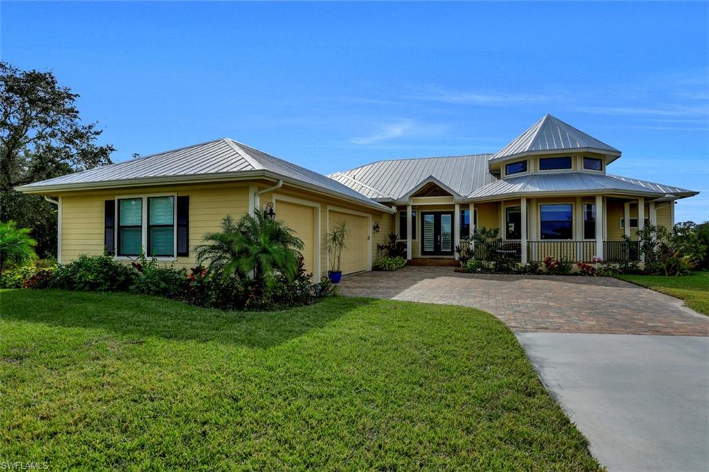Gorgeous Florida style 1+ acre custom estate in the quaint community of Buckingham.Enjoy the wide open spaces and escape the city life.Horse Creek, an upscale gated  minutes to I-75,River District and all Ft Myers has to offer.Pristine home w/over $165K in upgrades.Extended paver driveway, oversize 3 car garage w/lots of storage,Hardie Board siding, French doors & decorative architecture.Stunning Acacia hardwood floors,tray ceilings,crown molding,custom window coverings & light fixtures.Great room floor plan w/custom kitchen, upgraded granite counter tops,breakfast bar,stainless appliances,walk in pantry & beverage cooler.Unique turret can be formal dining room,study or sitting room.Luxurious Master ensuite with tray ceilings, spa type bathroom with soaking tub, granite, dual sinks & walk thru shower. Guest rooms with Jack and Jill Bath.Huge 4th bedroom perfect for game room, home office or entertainment.Inviting outdoor living space w/unique salt water pool,outdoor kitchen,fireplace,panoramic view screen,paver lanai & lots of room to chill.Impact Glass.Private lot overlooking lake & butterfly garden.Quiet county life w/private riverfront park,kayak launch & lots of walking trails.