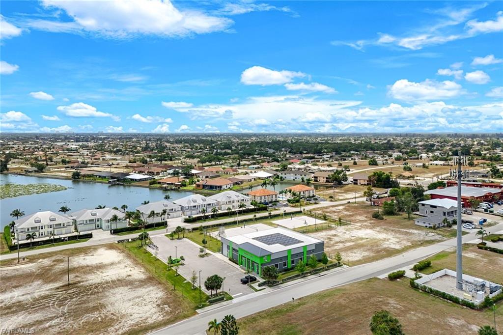 Built in 2019 this 8,550 +/- sf concrete block building sits on 2.3 acres. Currently a tenant (fitness training facility) occupies the southern section of the building (7,350+/- sf) which also offers outside volleyball courts and outdoor fitness equipment. There is a private office (1,200+/- sf) on the northern side which fronts on SW 2nd Terrace. Building has 60 roof top solar panels (solar edge), electricity invoice is typically $0.00 per month. Many commercial uses are available within the Pine Island Road Corridor. Building is in excellent condition and there's plenty of room for expansion.