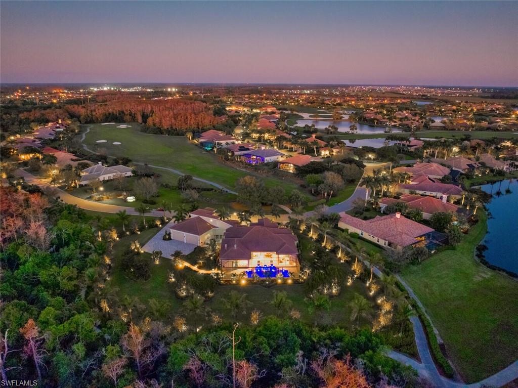 PLEASE VIEW VIDEO TOUR of this extraordinary estate for the discerning buyer desiring livable luxury, superb craftsmanship, architectural refinement, and peace of mind. A true one-of-a-kind custom residence set amidst a carefully curated landscaped sanctuary with strategically placed ambient lighting to enhance beauty and privacy. This home's incomparable distinctive features include a fully air-conditioned 1,921 square foot garage with commercial-height garage doors and capacity for 12-cars, RVs or large boats and expansive motor court, a Fort Knox concrete-fortified safe room with 32-camera security system, spectacular resort-style pool and spa, a South African Braai room designed for open-air or air-conditioned smokeless grilling, equipped with a generational Kalamazoo hybrid grill, wok and pizza oven and more. The architectural design and floorplan allow for a seamless indoor-outdoor connection. Refined Legno Bastone European wide-plank white oak flooring, custom cabinetry and closets, designer tile, and statement lighting accentuate the sophisticated and bespoke interior. The chef's kitchen features a full suite of Thermador professional appliances including a natural gas Pro Grande 6-burner smart range with griddle and steam convection oven. The most advanced million dollar technology package complements the thoughtful interiors, including a JBL professionally certified home theatre, furnished with eight American bison-leather recliners for the ultimate in durability and comfort and full-house Bowers & Wilkins surround sound system, and intuitive Savant Smart Home technology.  The primary wing is a peaceful retreat with expansive his-and-hers custom closets and dressing areas, a spa-like bath, and motorized shades opening to reveal 90-degree sliding doors to a private outdoor living area adjacent to the bedroom. Three additional en-suite bedrooms, a light-filled home office, service court, butler’s pantry, and dry good pantry complete this remarkable residence. Located in the desirable Verandah private golf community featuring two championship 18-hole golf courses, tennis, fitness center and spa, dining and more! Welcome Home to a most luxurious lifestyle in this exquisite residence.