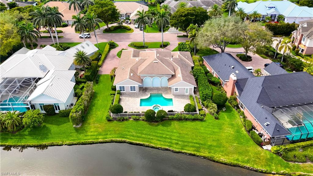 Indulge in the pinnacle of luxury estate living within the prestigious enclave of Georgetown at Pelican Bay. This highly sought-after and rarely available lakefront property presents a truly exceptional opportunity to own in one of Naples’ most refined and private communities. Tucked behind a manned guard gate, Georgetown is an intimate enclave of just 35 single-family residences, known for its lush tree-lined streets, meticulously maintained grounds, and timeless architectural charm. Residents enjoy the tranquility and privacy of estate living while being just moments from the world-class amenities of Pelican Bay, including a beach access tram that provides seamless entry to private white sand beaches, beachside dining, and full beach attendant services. The community also features a state-of-the-art fitness center, group exercise classes, wellness programming, scenic walking and biking paths, kayaking, and an active tennis program. Ideally positioned near the luxury boutiques and restaurants of Waterside Shops and the renowned cultural attractions of Artis—Naples, home to The Baker Museum and Naples Philharmonic, Georgetown also offers easy access to the vibrancy of Mercato, the charm of Fifth Avenue South, and the stunning Gulf Coast shoreline, making it one of the most desirable addresses in all of Naples.