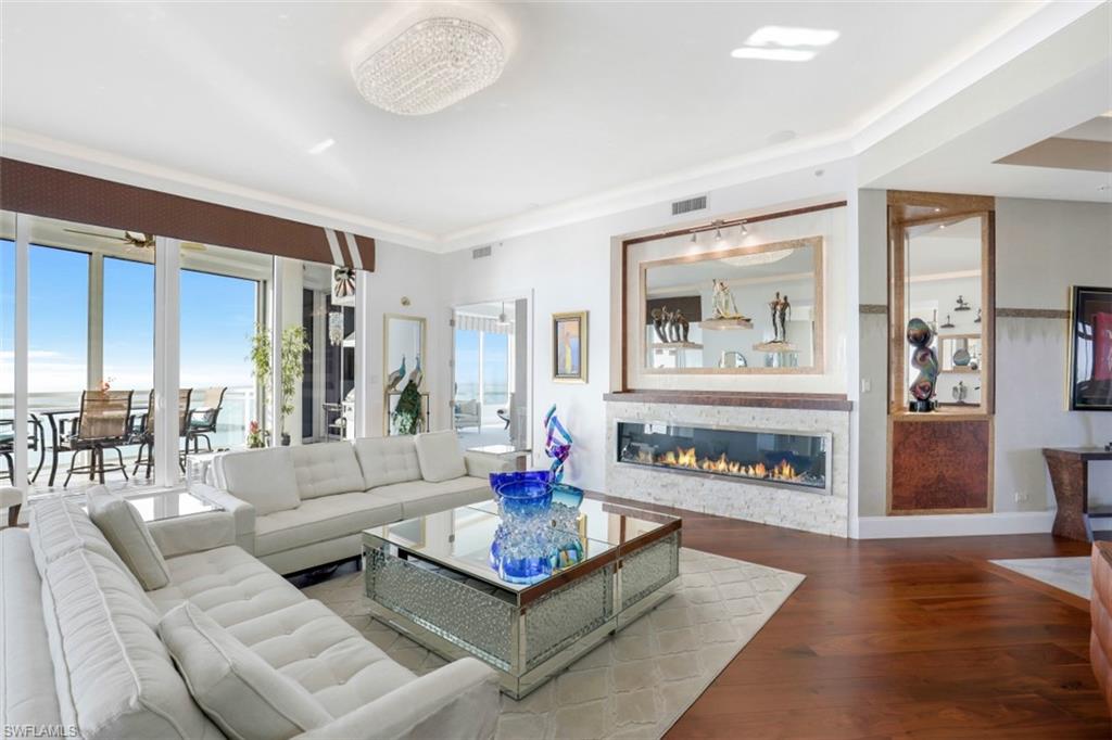 C5045- One-of-a-kind south end top floor 4,600sf 4 bed/4.5 bath quality Furnished Penthouse providing the ultimate high-rise lifestyle. A private elevator Foyer provides a grand & prestigious double door entrance to this luxury home with many unique wall treatments & designer improvements. The Kitchen & Family room have high-quality built-ins of Brazilian “book matched” Rosewood and a feature wet bar & wall display wine storage. The gourmet Kitchen countertop is Labradorite providing iridescent blue and silver color tones. The bar countertop of Argentine Quartzite has programable back lighting. From the Living room and Dining room extends a Terrace with automated roll down screens, glass railing, a gas grill and storm shutters. There is a 1057sf PRIVATE west facing roof top Terrace with another gas grill and large A/c storage closet. There is an integrated programable lighting & audio system that controls window shades & roll down screens on the Terrace. The luxurious Owner’s Suite has a large sitting area and a beautifully designed Bathroom with a glass shower wall & free-standing tub. Oversized 3 car private enclosed Garage with upgraded flooring & cabinetry and air conditioning.