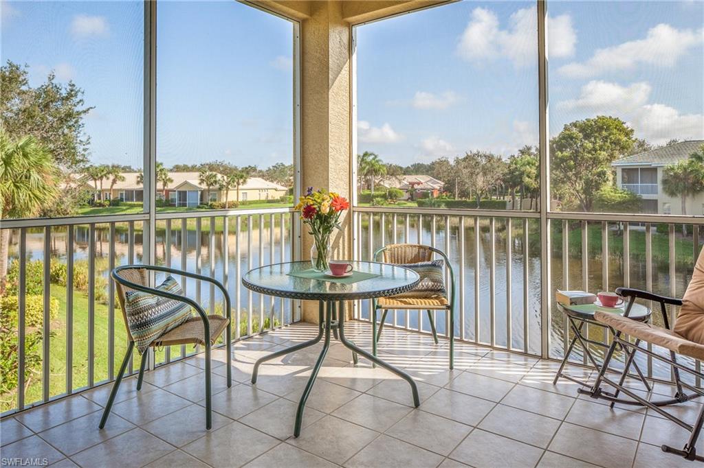 What a great view of the lake with two fountains in this desirable neighborhood.  The Pointe in Pelican Landing, second floor end coach home with a one car garage close to pool.  This delightfully finished condo is well maintained and perfect for seasonal or full time residents to enjoy the carefree Florida Lifestyle. Wood laminate floors, tiled lanai, Lake view with lighted fountain, new Ac.  Located in amenity rich Pelican Landing with private beach island, tennis, pickle ball, bocce, fitness, sailing fleet, canoe park, boat ramp all included.  Its a must see.