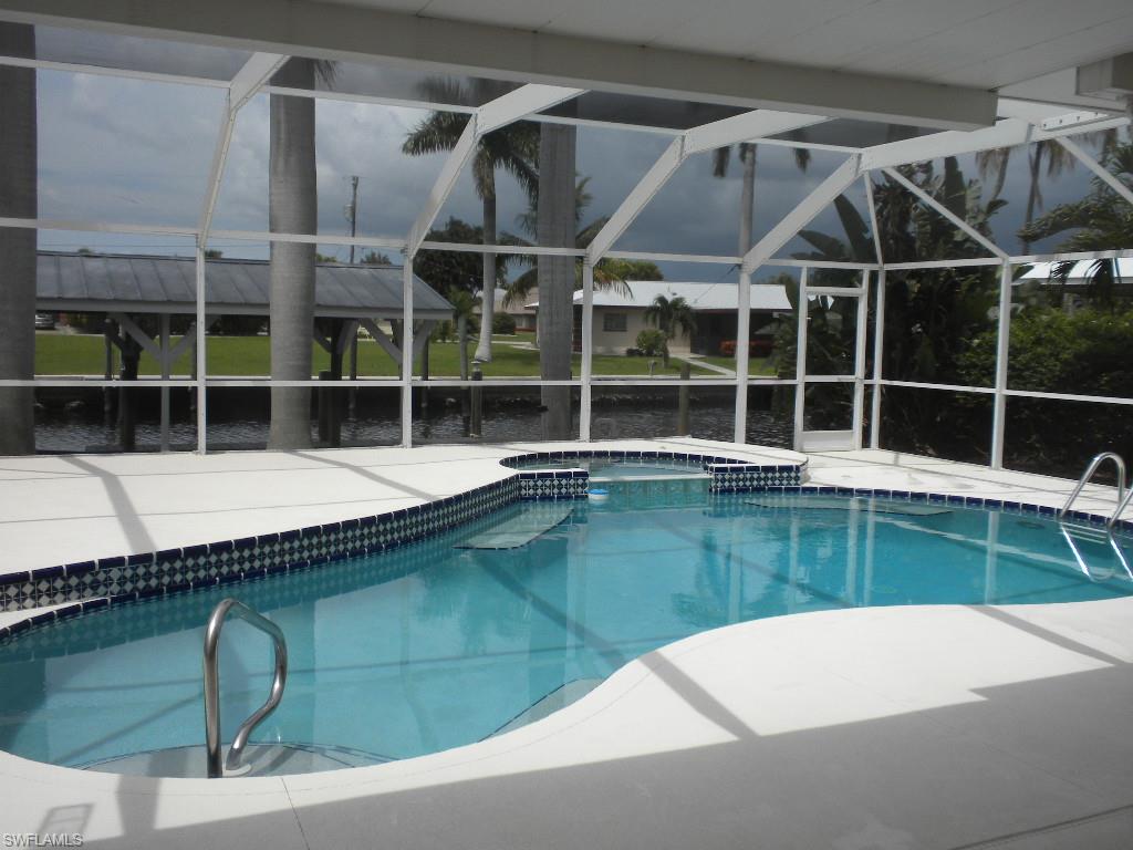 Live in Paradise in this beautifully renovated 3 bedroom 2 bath pool home.  Newer Kitchen Cabinets with Granite Countertops.  Large Pool spa area with a newly sprayed deck.  Lots of room on the deck for sunning and entertaining.   Both Bathrooms have been remodeled with new countertops and cabinets.  Tiled Throughout the main areas with carpet in the bedrooms.  Sit out on the boat dock and watch the most beautiful sunsets in SW Florida or just relax watching Eagles, Ospreys, Herons, Fishing Jumping.   Quick boating access to the best fishing in SW Florida with no bridges.  This is your chance to truly own a paradise hideaway.