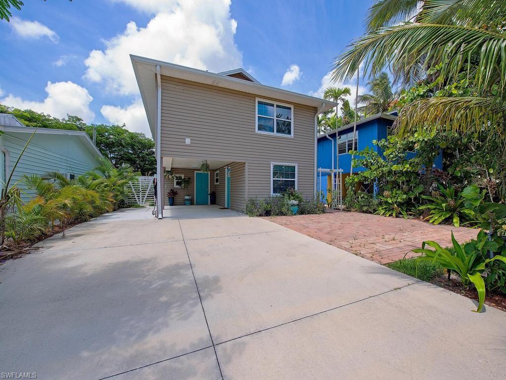 Rare Duplex Opportunity in the Bayshore Area! Perfect for short-term rentals, this versatile property offers the ability to live in one unit and rent the other, or maximize income by renting both. Located in an area experiencing significant redevelopment, with many neighboring properties being rebuilt, this is an excellent investment for today and the future.
Enjoy views toward the bay from the rear balcony overlooking the prestigious Windstar community. The property features a hot tub, two spacious lanais, abundant parking, and a carport large enough for your boat.

The lower level offers a unique 1-bedroom, 2-bath layout with direct access to the hot tub and outdoor living areas. Upstairs, you'll find a 2-bedroom, 1-bath residence plus a bonus sleeping den, providing flexible accommodations for guests and renters.

Just down the street is a beautiful bayfront park with stunning views of Port Royal, three public boat ramps, excellent fishing, a playground, and waterfront green space. The vibrant Bayshore Arts District and Sudgen Lake Regional Park are just a short bike ride away, offering dining, entertainment, lakes, walking paths, and recreational activities.

Whether you're looking for an income-producing property, a vacation retreat, or a redevelopment opportunity, this duplex offers exceptional potential in one of Naples' fastest-growing waterfront neighborhoods.