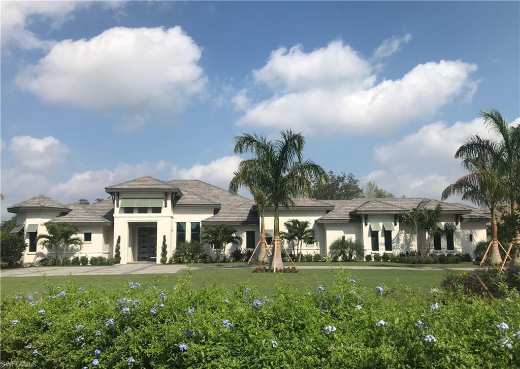 The St. John's MODEL by Florida Lifestyle is a four-bedroom, 4.5 bath open floor plan. Sitting on a lot that is over 1.2 acres, the St. John's features finely detailed ceilings including a barrel ceiling in the study, decorative coffers in the Great Room and Foyer and coffered ceilings with beams in the Master Suite.  Porcelain tile floors feature a wood inlay at the foyer, hallway and dining room. The kitchen features a grand island, butler's pantry, dual dishwashers and double ovens among other gourmet details. This plan features a wonderful indoor/outdoor connection to an expansive outdoor living area featuring a fireplace, summer kitchen and fire pit.  The luxurious pool and spa with water feature complete the ultimate package of Florida living.  This lot is located on the golf course with a water view.  Every detail is exquisite with Florida Lifestyle Homes' quality and attention to detail.  A $40,000 Builder credit toward the social membership is currently being offered..