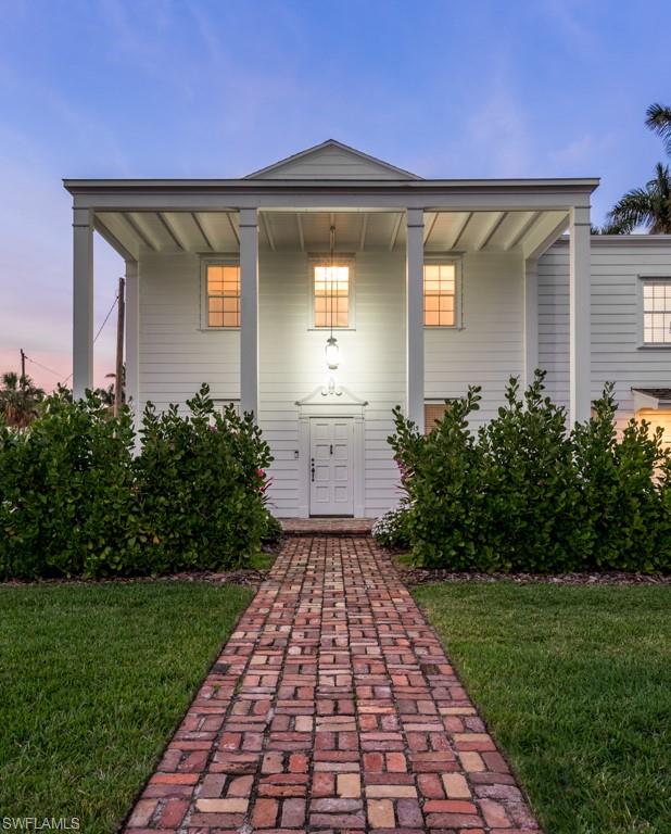 Classic cottages that exude character and charm. Original heart pine floors were uncovered and refinished. Classic beach house design and decor. Newer A/C systems, and newer roof in 2010. In addition to the main home, this property contains two unique and rare guest houses which are separately rentable. One is a 2 bedroom, 2 bath guest cottage with single garage and a 1 bed studio apartment with kitchen and laundry above detached garage. Oversize yard areas with brilliant landscaping and room for pool create an estate like feel right in the sweet spot of Old Naples, a convenient walk to both 5th Avenue South and 3rd Street South shops and dining, and less than 2 blocks from our sugar sand beach. Underwent restoration and many upgrades in 2017 and may qualify for a Fema exemption.