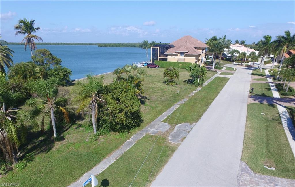 RIVER FRONT! EXCELLENT VIEWS - all way to Marco Jolly bridge! Price reduced to meet market. Oversize site with new seawall 2006. Walk it!  See it!  Design your dream home, or chose on from our builders. Imagine relaxing, entertaining, or family visits at home in this spectacular location. Great land investment, too!