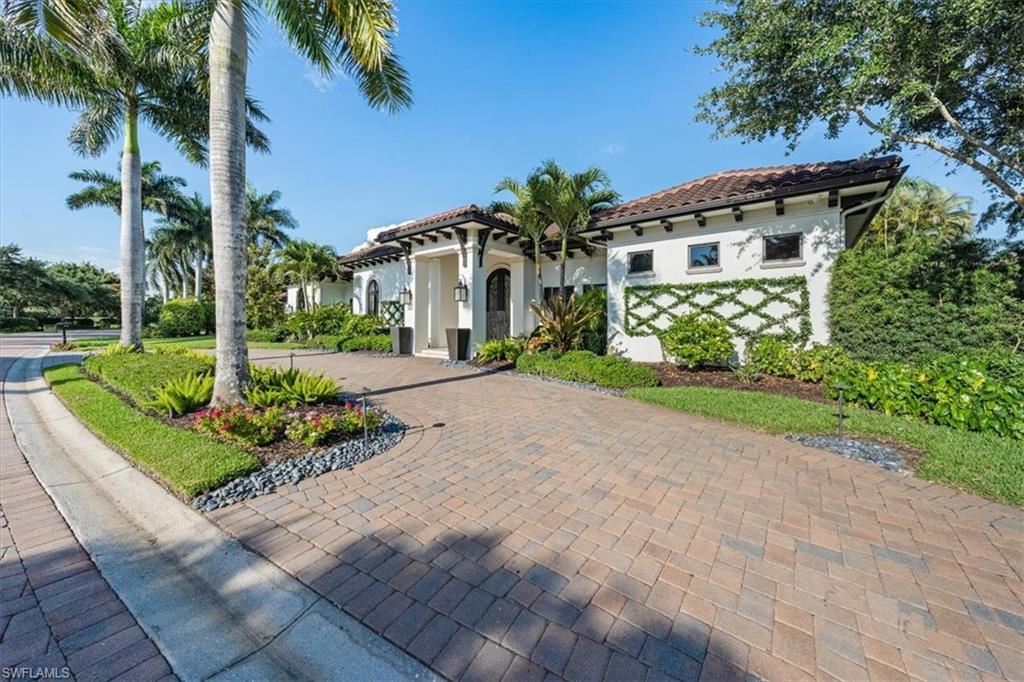 Stunning Stofft Cooney designed home in sought after Miramonte in Grey Oaks being sold beautifully furnished. The 4,047 sq ft masterpiece custom home on an oversized corner lot has circular drive and charming water features. Enter the gracious foyer and you’re immediately captivated.  Eyes are drawn to the soaring ceilings and you’re awash in an abundance of natural light.  The foyer opens into the great room, seamlessly blending living and dining with the state of the art kitchen that would make even the most sophisticated cook envious.  An enormous island, commercial stove, steam oven and double refrigerator, ice maker and wine storage for 180 bottles together allow grand entertaining.  Off the great room is approximately 845 sq ft. outdoor family room with electric screens, fireplace and televisions.  A summer kitchen hosts drawer refrigerators and bar seating. Privacy abounds in the backyard with lush landscaping and a custom pool & spa with fire bowls.  Off the foyer is a large study and half bath.  Just beyond, through double doors, is the luxurious owner’s suite with a quiet sitting area and impressive custom closets. The owner's bath is huge and richly done with a walk-through shower and soaker tub.  The opposite end of the house holds 3 additional guest rooms, all ensuite, as well as a large laundry room.  This custom home has an oversized 3 car garage & a 4th bay for a golf cart.  Privacy, gracious living and a high level of detail make this a very special offering.
