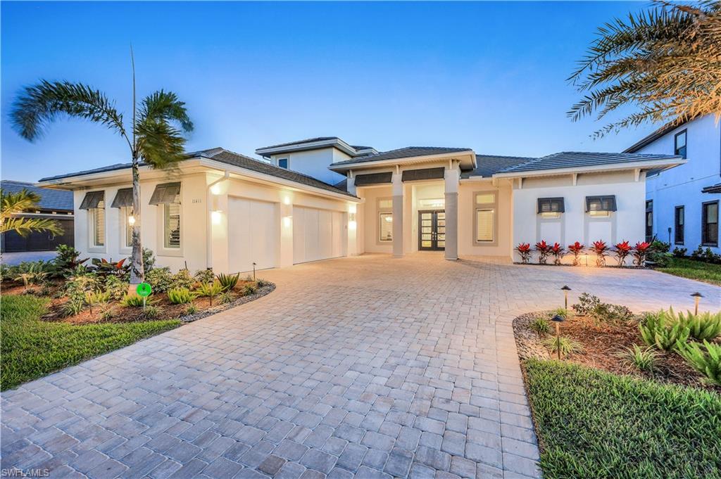A MUST SEE! Southern facing with direct panoramic lake views overlooking Lake Como featured from this fabulous "Beacon" model located in Fort Myers hottest new community, Esplande Lake Club. Being less than 1 year old, this modern home does more than just impress, almost 5,000 SF living, OFFERED FURNISHED: 4BD, Den, 4 full bathrooms, 2 half baths, 3 car garage & an upstairs bonus room w/wet bar along with 1 BD, full bath & powder. Other features include: hurricane windows & doors, Storm Smart Hurricane screens, tankless water heater, designer kitchen, custom millwork & more! Seamless open floor plan throughout. Master en-suite located on first floor. True paradise awaits in your own backyard! Oversized panoramic screened lanai overlooks Lake Como and includes marble flooring, new outdoor kitchen, luxurious heated pool & spa w/ sun-shelf. Walk right outside to take a boat ride from your own private boat dock!Esplanade Lake Club is lakefront resort-style community positioned around a 352 acre lake.Discover an active yet relaxing lifestyle w/ amenities including: resort pool, Bahama Bar & Grille, sports courts, community boat ramp, kayak launch, nature trails,Lifestyle Manager & more!