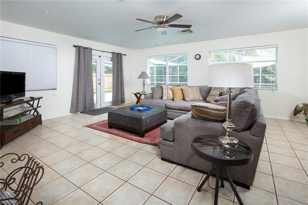 One of the largest homes in Poinciana Village! This beautiful 3 bedroom, 2 bath home with a huge pool features completely renovated master bedroom and guest bathroom (2018), new heating and air (2017), exterior and interior freshly painted (2017), a newer roof (2015) that has been strapped for hurricanes (2017), newer appliances, newer kitchen and master shower (2013), new pool equipment (2017), new wood fence (2017) that completely encloses yard, updated master closet (2017), and freshly screen lanai covering the large in-ground pool. The home also has a one car garage and attached carport. Location, location, location! A bike ride to the beach, Naples Zoo, Nature Conservancy, schools, dining and shopping! Quiet neighborhood with great neighbors and walkability! No association fees!