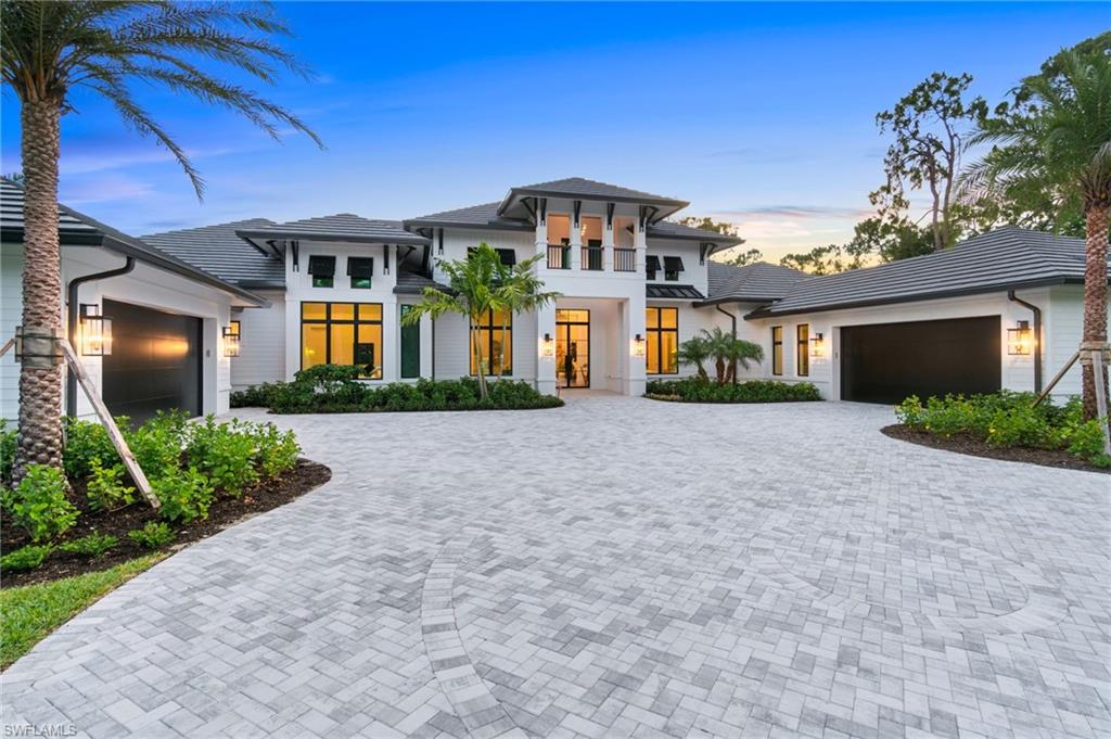 Welcome to 337 West Street, a brand-new construction estate home offering extraordinary western views overlooking the gorgeous lake, all while delivering unparalleled luxury. Spanning nearly 6500 square feet under air, this magnificent home features 5 spacious bedrooms, an office, a home gym, and a versatile bonus room, designed to meet all your lifestyle needs. As you step inside, you'll be captivated by the incredible oak kitchen, equipped with top-of-the-line Wolf and Subzero appliances. This culinary haven is perfect for both casual family meals and grand entertaining. The open-concept layout seamlessly connects the kitchen to the living and dining areas, creating a warm and inviting atmosphere. The expansive covered lanai is an outdoor enthusiast's dream, complete with an outdoor fireplace and a sunken fire bowl, ideal for gathering with friends and family. The infinity edge pool offers stunning views over the lake, making every swim a serene experience. The property boasts a 4-car garage, providing ample space for your vehicles and storage needs. Pristine landscaping surrounds the home, ensuring amazing privacy and a tranquil setting. The western exposure allows for endless sunsets, making every evening a picturesque retreat. This is a rare opportunity to own a piece of paradise at 337 West St. With its blend of modern elegance, exceptional amenities, and breathtaking views, this home is truly a sanctuary. Don’t miss your chance to make it your own.