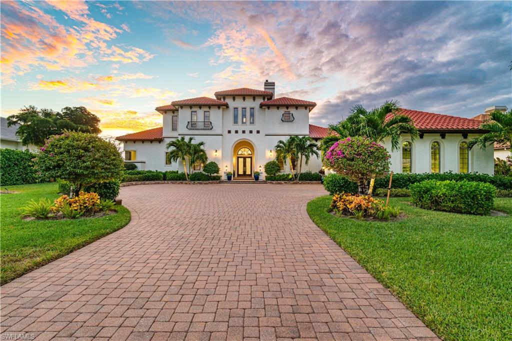 H12669   Magnificent Audubon Estate Home with stunning lake, preserve, and sunset views. This Beautiful home is located on a 0.6-acre estate lot offered in Audubon Golf & Country Club. This North Naples' property was beautifully renovated with a Western exposure for prime sun on the spacious pool deck. Relax & unwind in the extremely private & fully screened-in pool/spa with ample living space & an outdoor kitchen – perfect for entertaining. This coastal contemporary home is finely appointed with marble & tile floors, an open floor plan & fully pocketing sliders. Gorgeous chef’s kitchen was recently renovated & features custom cabinetry, professional grade appliances & a gas range. Delight in 4 bedrooms/den with a large master suite, newly renovated master bath & guest suite on the first floor! The 2nd floor features 2 guest rooms & a spacious terrace overlooking the beautiful water views. Lushly landscaped for ultimate privacy. Audubon is perfectly located 5-minutes from Mercato & world-class beaches, with gated/guarded entry, 18-hole championship Golf Course, tennis, pickleball, Bayside boardwalk, newly renovated clubhouse with dining & spectacular poolside club & café.