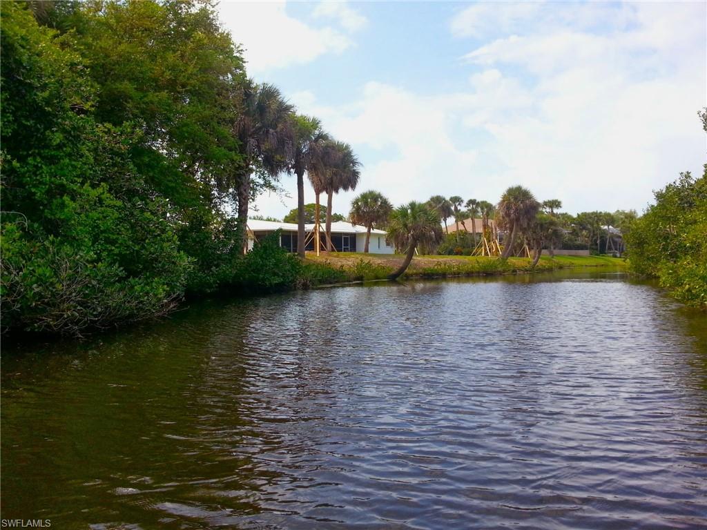 Set in a tropical oasis of mature landscaping this charming and spacious split bedroom plan home offers traditional elegance with 3 bedrooms, 2 baths, a 2 car garage and is located on close to a 1/2 acre of WATERFRONT property on Amberjack Creek leading to the Gulf of Mexico. You will delight in the privacy and secluded atmosphere while sitting on your lanai watching the abundant wildlife just across the canal in the stand of native mangroves and perhaps seeing a Manatee swim by in the canal. Hard to guess from there how convenient a location this really is - just minutes to the Placida Publix Complex for your everyday grocery, banking and post office needs. If you are craving a walk on one of the most beautiful beaches in the world then take a 6 minute drive to the Boca Grande Causeway. As you cross over to the island the scenery is spectacular – gorgeous turquoise water melts into the distant horizon. Ready for a bit of adventure - take your boat out for a wonderful day on the water or just fish from your own dock! This property has many upgrades and features. Preparing meals will be a pleasure in this kitchen updated with solid wood cabinets and granite counters plus a peninsula open to the breakfast area. The metal roof and upgraded insulation are a plus in conjunction with the solar panels for energy savings. If the wanderlust for adventure is calling you there is a 50 amp RV connection for your convenience. This home is perfect for entertaining or relaxation, the screened lanai opens through huge sliding glass doors overlooking the tranquil wide canal. Say goodbye to chilly winds and icy snow and enjoy life in paradise. Sandy beaches, world class golf courses, boating, fishing, and nearby Sarasota art, entertainment and nightlife, great shopping, restaurants from casual to gourmet. This location truly has all the good life has to offer.