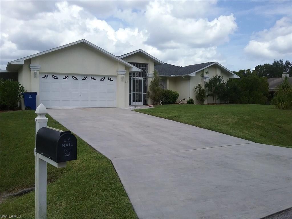 Furniture is included in this beautiful pool home situated on a quiet dead end street.  This 1 acre gem is located in the Lake Camille area, palm and citrus trees galore.  Mirrored wall in living room, walk in master closet, tile in all areas except bedrooms.  Pocket sliders in living room and master bedroom lead to the sparkling solar heated pool area with a fresh pebble rock deck.  This is an open spacious floor plan that would serve all of your entertaining needs.  Own a piece of Florida sunshine!