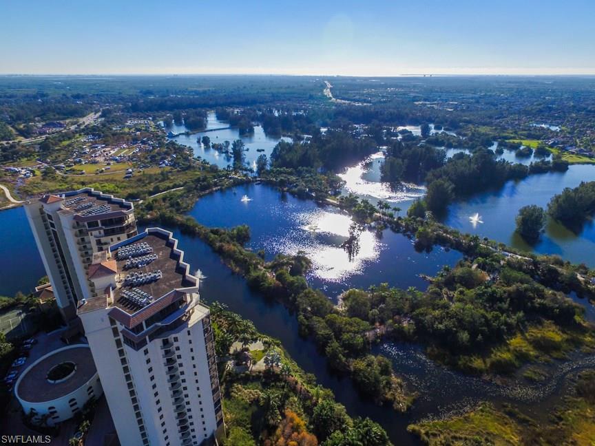 PRICE REDUCTION! Highly sought 17th floor "01" end unit in South Tower is beautifully upgraded. Wide, screened lanai offers a serene, panoramic view of 300-acre Lakes Park. Very open great room design with spacious kitchen is what sets this floorplan apart. Kitchen has beautiful cabinetry, granite counters, cabinet space galore, upgrades like a hands-free faucet, instant hot water, filtered water & long bar that will be perfect for entertaining. Beautiful upgraded tile & wood flooring throughout. BR #2 is perfect for guests with an ensuite bathroom & private balcony. BR #3 makes a great den/office. All 3 bathrooms are upgraded with bowl sinks, granite counters. Everything is in perfect condition so you can spend your time relaxing on the lanai overlooking nature, walking/biking in the park, enjoying the invisible edge pool, working out in the well-equipped fitness center or socializing with friendly neighbors. You'll love the close-to-everything location--shops, restaurants, beaches, airport are just a few minutes away. Not one, but two parking spaces + a storage room in the under-bldg parking garage. And, yes, your 1-2 pets are welcome here too. This one is special--see it today!