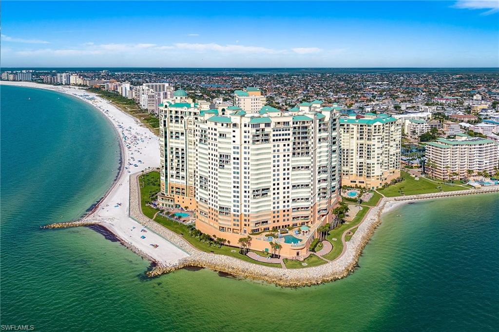 A Rare Elevation of Luxury: The 24th-Floor Belize Penthouse Estate

Step into the sophisticated world of the Belize Condominium at Cape Marco, where sweeping Gulf vistas, exquisite craftsmanship, and world-class amenities define one of Marco Island’s most coveted residential experiences.

Perched on the 24th floor, this spectacular estate encompasses 6,968 total square feet of refined coastal living, features four bedrooms, four-and-a-half baths, and commanding panoramic views in every direction. A private owner-controlled elevator opens directly into the grand living and dining spaces, which flow seamlessly onto an expansive Gulf-front terrace. A richly detailed panel box–beam library/office with a custom fireplace adds warmth, character, and timeless sophistication.

The gourmet dine-in kitchen is designed for culinary excellence, featuring custom cabinetry, a gas cooktop, Sub-Zero refrigeration, and abundant preparation and storage space.

The primary suite serves as a sanctuary of serenity with a marble spa bath, sauna, jetted tub, walk-in shower, his-and-her vanities, and dual walk-in closets. Three additional en suite guest bedrooms, each with its own lavish baths, walk-in closets, and private water-view terraces.

A beachfront study, further elevates the lifestyle, complete with a wet bar, a walk-in temperature-controlled wine cellar, and terrace access, is great for intimate entertaining or contemplation by the sunset.

Throughout the residence, elegant finishes underscore the home’s exceptional quality, including fine marble flooring, hand-applied wall textures, crown molding, architectural arches, tray ceilings, and intricate decorative millwork.

Additional features include two deeded underground carport parking spaces, gated entry, and 24-hour security.

Residents of Cape Marco enjoy an unparalleled luxury lifestyle with access to:

24-hour front desk

Guest suites

Resort-style pool & spa

State-of-the-art fitness center

Club rooms, bar, and billiards

Tennis courts

Fishing boardwalk

Direct beach access