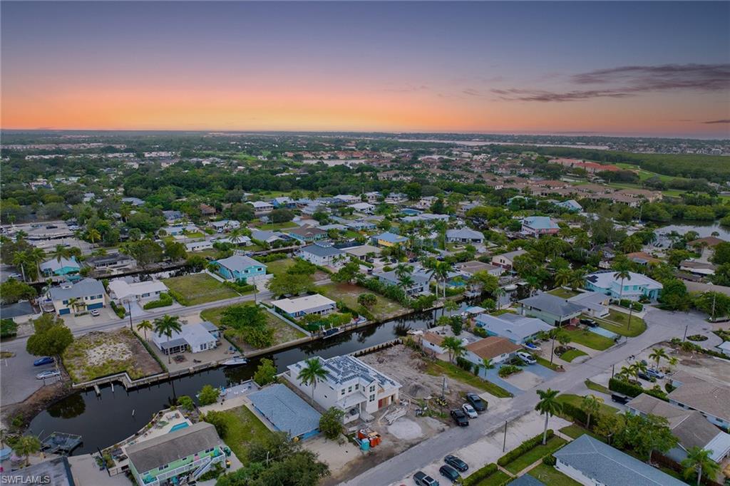 Completion this February! Absolutely stunning brand new construction waterfront home with direct Gulf access. No bridges. Private boat dock and lift. Perfectly nestled along Shoreview Drive within the highly coveted Bayshore Arts district, this immaculate new build by Naples Custom Homes, boasts 4 bedrooms, plus den or flex space, 3 full baths, a private heated pool and spa, brand new seawall and nearly 3,100 square feet of air-conditioned living. This family-friendly waterfront residence is an entertaining dream. Within minutes to downtown 5th Avenue, fine dining, shopping and entertainment, pickleball courts and the sugary white-sand beaches, this fully furnished/model package also offers rear southern exposure, a chef's kitchen with double-wall oven, custom panel Bosch appliances, an outdoor/summer kitchen with grill, 2 and half car garage and over 4,000 square feet of total lifestyle space. With an easy 15-minute boat ride to Naples Bay and the Gulf, this is a boater's dream residence. Over 65' of pristine water frontage and 10,000-lb lift comfortably accommodate any watercraft up to 26'. Within biking/golf cart to fine dining, shopping and entertainment. Will not last long.