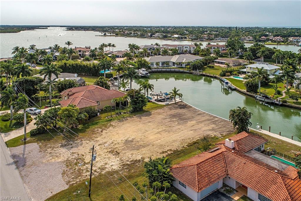 Build your dream home on this gorgeous, waterfront lot with new seawall, western exposure and stunning panoramic views! Watch the dolphins play every morning from one of the most desirable lots in all of Naples. Perfectly located just minutes from Naples Bay with direct access to the Gulf of Mexico.