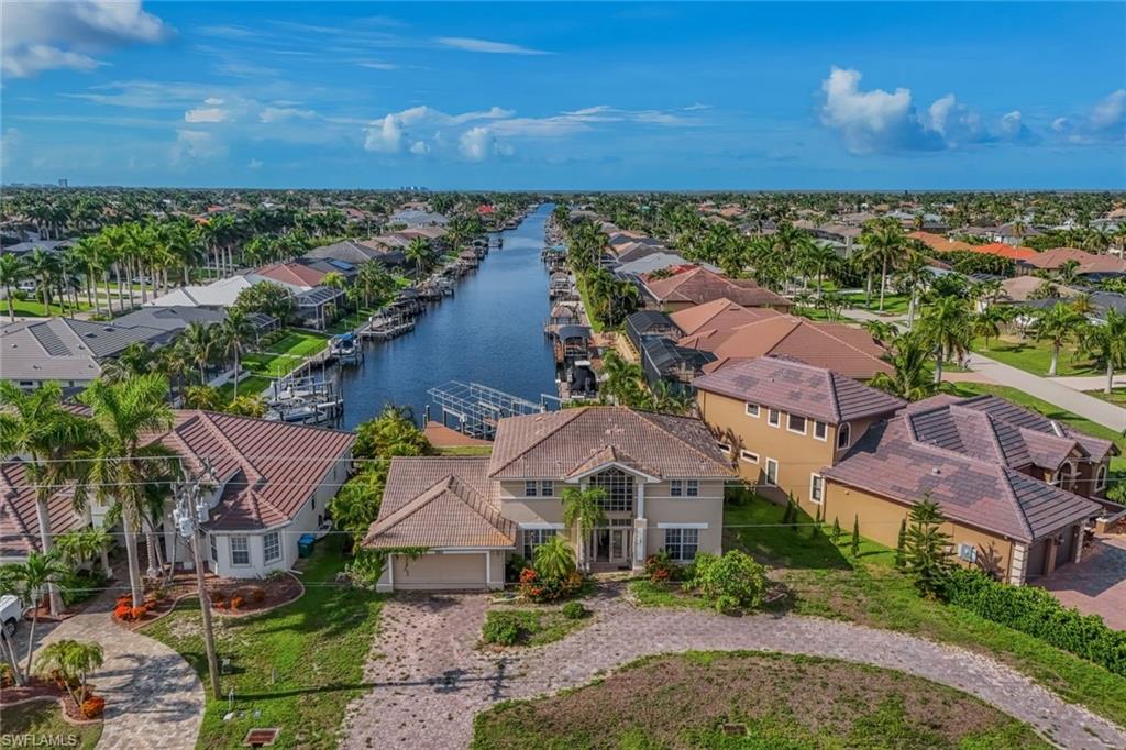 Attention investors! Rare opportunity to own a spacious two-story Gulf access pool home in highly desirable Southwest Cape Coral, Unit 72. Offering over 2,700 square feet of living area and approximately 4,751 total square feet, this waterfront property features 3 bedrooms, 2 full bathrooms, 1 half bathroom, and an excellent floor plan ready for your vision. The second-floor primary suite includes a private waterfront veranda, while the spacious living areas showcase cathedral and tray ceilings. Enjoy southern rear exposure with breathtaking long canal views, a screened pool, easy Gulf access, and a two-car garage. The home is ready for updating and presents an outstanding opportunity to renovate and add value. Whether you’re an investor, builder, or buyer looking to create your dream waterfront home, this property offers exceptional potential in one of Southwest Cape Coral’s most desirable Gulf access neighborhoods.
