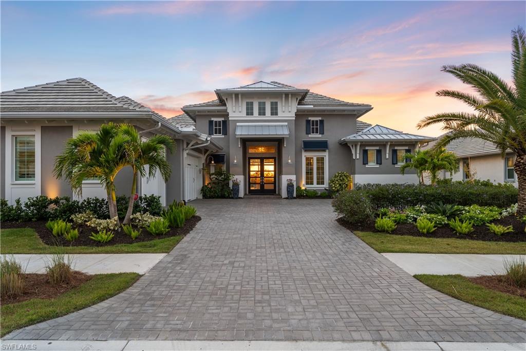 Rarely available and coveted Cocoplum model built by award winning builder STOCK, this estate home is situated on one of the most desirable streets in the private gated section of the Isles of Collier’s Preserve with only 61 homes that back up to beautiful preserve, stunning sunsets and privacy galore. 8923 Nevis Way is new construction, in like new condition. Finished in 2024, it spans an impressive 3,641 square feet of living area with an additional 1,896 square feet of outdoor living to enjoy the breathtaking preserve views. This 4 bed + den, 4.5 bath Cocoplum was built with $640,000 in high quality STOCK builder upgrades, notably hardwood flooring, upgraded kitchen and appliances and oversized pool/lanai area. Designer interior furnishings, custom curtains, art work and lighting, meticulously curated by Soco Interiors, provide a move in ready upscale luxury retreat, with sophistication and serenity at every turn. Additionally, $150,000 of enhancements to the home after close include Custom Inspired Closets, Storm Smart hurricane screens for effortless protection, a 26kW whole-house generator with a 10-year warranty for uninterrupted comfort, garage door insulation and mini-split for energy efficiency and year-round climate control, premium LG OLED TVs for a truly immersive entertainment experience, a Kinetico whole-house water purification system, Plantation shutters, custom landscaping and an expanded driveway, making this home a great value for the discerning buyer. Outdoors a professionally designed resort-style oasis, featuring expansive covered and uncovered spaces, a gorgeous over sized salt water gas-electric heated pool and spa along with “no-see-um” screened lanai and complete bug spray system by SWAT, outdoor kitchen, and comfortable high-end furniture to enjoy sunsets on your Southwest Exposure. Set within more than 2,400 acres of unspoiled beauty, The Isles of Collier Preserve is a gated enclave with over half the community devoted to lakes, preserves, and natural surroundings. Residents enjoy world-class amenities including The Isles Club, The Overlook Bar & Grill, tennis, pickleball, and bocce courts, eight miles of scenic walking and biking trails, kayak and paddleboard launches, and the Canine Cove dog park. Just minutes from downtown, white sand beaches, the Naples Botanical Garden, and the Bayshore Arts District, this extraordinary home presents a rare opportunity to experience luxury living immersed in nature. Perfectly situated just minutes from historic downtown, Naples’ famous sandy white beaches, and the Bayshore Arts District, you are sure to enjoy SWFL living in this exclusive community. This section of the Isles adjoins to the Hamilton Harbor Yacht Club, a magnificent club and marina right in your backyard.