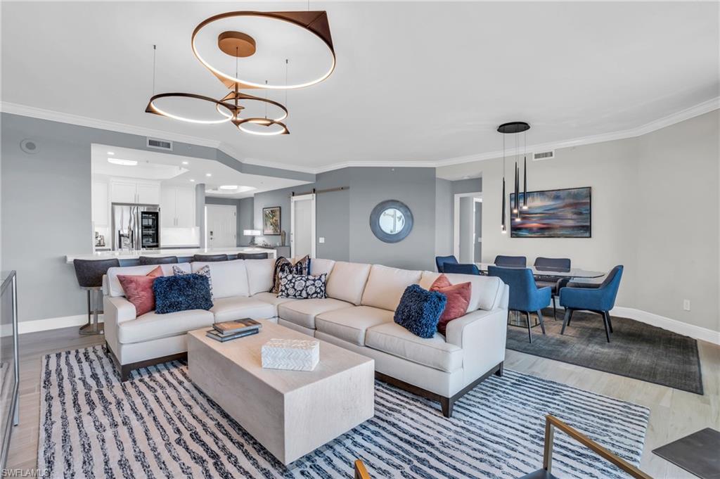Welcome to Caribe at Cove Towers. Wait until you see this 6th floor view. Encompassed in this open floor plan is 3 bedrooms, 2 full baths including an en-suite spa like bath and dual closets in the primary bedroom with views of the gulf and lanai access. Living in Naples is all about the lifestyle and this property showcases that at a high level. As you step inside to this fully renovated condo, the breathtaking views and elegant design immediately draws you in. The open floor plan seamlessly integrates the living, dining and kitchen areas creating a harmonious flow and casual sense of sophistication and comfort. The chef’s kitchen features a wine cooler, spacious eat-in peninsula with quartz countertops enhanced with under cabinet and overhead lighting. The expansive, comfortably furnished lanai with electric storm shutters is perfect for relaxing and savoring the stunning Gulf sunsets during the winter months. There is plenty of room for guests in the secondary bedrooms, with one currently serving as a study and another renovated full bath in the hallway. Spacious enough for year round living and could also serve as the perfect second home to just turn the key with nothing to worry about while you are out of town. Included is a membership to the Tarpon Cove Yacht and Racquet Club. A place to unwind, socialize, dine and play. Members can access one of Naples finest beaches without the hassle of parking directly from the dock at the Club, aboard the Endless Summer. Begin living the good life in Naples today.