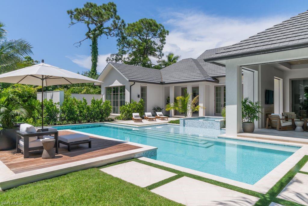Centrally located in Coquina Sands on a large southern exposure lot 2 blocks to the beach, just finished and ready to show. Penned by Stofft Cooney Architecture and built by Equinox Construction Group. This striking home with five bedrooms, each having their own ensuite baths, offers plenty of space and privacy for residents and guests. The inviting entry welcomes you with a vine covered pergola and water feature. This home boasts a Club Room, a chef’s dream kitchen with custom cabinetry by Ruffino, large island, Subzero and Wolf appliances, large walk-in pantry, a glass wine room, Lutron lighting and home automation. Beautiful French doors overlook the pool and fill the home with natural light. The spacious covered outdoor living area is perfectly equipped for entertaining with outdoor fireplace and summer kitchen. The exterior features include shell stone decking, automated roll down screens and shutters, full home generator, and beautiful tropical landscaping. This home boasts unrivaled finishes with 4 car garage and large driveway.