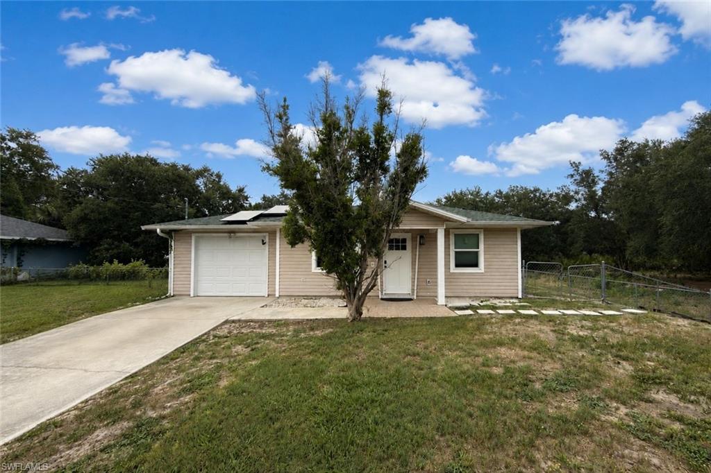 Welcome home! This 3 bedroom, 2 bathroom home, located in NW Lehigh is officially ready for its new owners! Featuring 1,144sqft under air and being sold as a PACKAGE DEAL with the vacant lot next door (2508 66th St W), this price is for the Single Family Home only. There's plenty of room to roam on 1/2 an acre! As you walk inside you're greeted by a SPACIOUS living room with a connected dining area, and windows letting in natural light. The kitchen is modern and bright with white cabinetry, stainless steal appliances, and solid surface countertops - perfect for meal prep and everyday use! All 3 bedrooms are generous in size. Both the primary bathroom and the guest bathroom have been COMPLETELY REMODELED, with modern vanities, tile accents, and stylish faucets/shower fixtures! You'll appreciate the peace of mind that comes with the big ticket items of this property already taken care of, which include a 2026 AC, ROOF REPLACED IN 2024, ELECTRIC PANEL 2023, and SOLAR PANELS! Not one, but TWO sheds in the backyard that are perfect for extra storage and convey with the sale, and the yard is FENCED IN and offers plenty of room to add a pool! Conveniently located near Sunshine Blvd, this home has it all... The only thing missing is YOU!