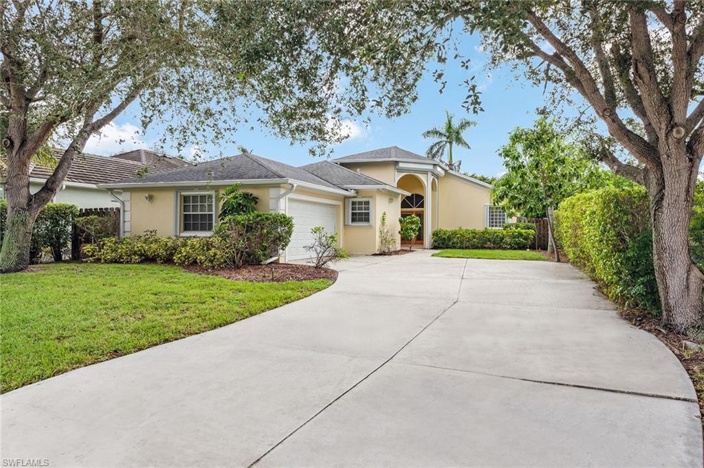 Built in 2000, this beautiful residence checks all the boxes with high ceilings, an open floor plan and plenty of natural light. In the flourishing Goodlette West neighborhood in Naples, you’ll be close to top-rated schools, white-sand beaches and turquoise waters. No approval is needed for pets and there are no HOA fees! Have peace of mind with a new shingle roof, hurricane shutters on all windows and doors, security system, 2020 air conditioning and a secure two-car garage. The screened back porch and fenced backyard are the perfect setting for a vegetable garden and a hot tub. Hideaway in the primary suite, with separate shower and soaking tub, dual vanities and dual walk-in closets. The open kitchen features stainless steel appliances, granite countertops, an island with a breakfast bar and pantry. The formal dining room could easily be transferred into a home office or fourth bedroom. Featuring tile flooring, new carpet in the guest bedrooms, and a neutral palette, this home is ready to add your personal touches. With only a short drive to downtown 5th Avenue, Waterside Shops and Mercato, you’ll experience the best shopping, dining and entertainment Naples has to offer.