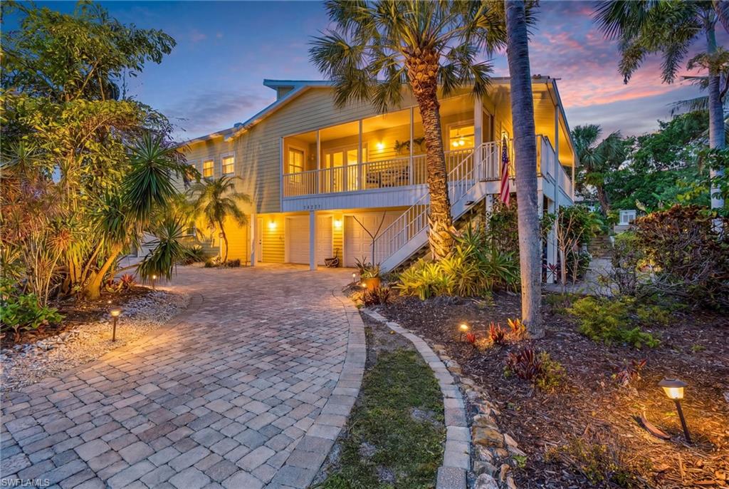 Welcome to paradise in the highly sought-after Alden Pines neighborhood of Bokeelia! Perfectly positioned on an oversized double homesite totaling 0.67 acres, this extraordinary coastal retreat offers the ultimate Pine Island lifestyle with an unbeatable location just a short walk to the clubhouse at the newly revitalized Alden Pines “The Gator in the Rough” golf course, Pineland Marina, Tarpon Lodge, and the historic Randell Research Center. With the golf course renovation nearing completion and reopening this fall, the future of this area has never looked brighter.

Encompassing an impressive 2,732 square feet of living space, this spacious residence features 4 bedrooms, 3 bathrooms, and an incredible 6-car garage with 3 tandem spaces — perfect for car collectors, golf carts, boats, kayaks, or all your island toys.

Outdoor living is where this home truly shines. The massive 35’ x 15’ resort-style pool and spa are surrounded by an expansive paver patio designed for entertaining, complete with a covered outdoor dining area, full outdoor kitchen, and convenient pool bath. Whether hosting family and friends or simply relaxing in your private tropical oasis, every inch of this property embraces the Florida lifestyle.

The luxurious primary suite feels more like a private resort retreat, featuring a screened wraparound balcony, dual walk-in closets, and an extraordinary dual-bathroom design connected by an oversized walk-through shower unlike anything you’ve seen before. The shower even opens to its own private outdoor balcony, creating a spa-like experience immersed in nature.

Designed for both comfort and peace of mind, the property also features an elevated Generac whole-home backup generator with a buried fuel tank, providing reliable protection and convenience year-round.

Lush tropical landscaping with mature palms, native vegetation, and vibrant greenery surrounds the property, enhancing the serene coastal atmosphere and providing exceptional privacy. This is a rare opportunity to own a truly unique island estate in one of Pine Island’s most desirable communities.