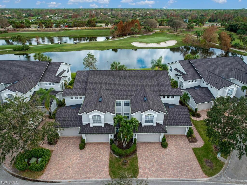 A light and bright condo with expansive views of the gulf course and lake in the much sought after Clubside at The Strand, a gated golf course and tennis community in North Naples is ready for you! Featuring both a golf course and lake view, this spacious first floor end unit coach home has a two car attached garage, glass enclosed lanai with electric storm shutters and is fully furnished. Enjoy watching the golfers on the large screened balcony, living room and eat-in breakfast area. The third bedroom is currently set up as a home office (see the floorplan.) The primary suite includes a walk-in closet, dual sinks and walk in shower. The Club at the Strand, a private club offers 27 championship golf holes, designed by Gordon Lewis, Tennis Center & recently renovated Fitness Complex with state-of-the-art fitness equipment, 8 Har-Tru tennis courts & recently added 3 Pickleball courts, Bocce courts, a heated Jr. Olympic pool and Day Spa. Members enjoy casual & fine dining too! 30 minutes to the International Airport. Minutes from Gulf of Mexico beaches, Regional Park, shopping, dining, museums, galleries & entertainment! Ask about club memberships details & special financing options!