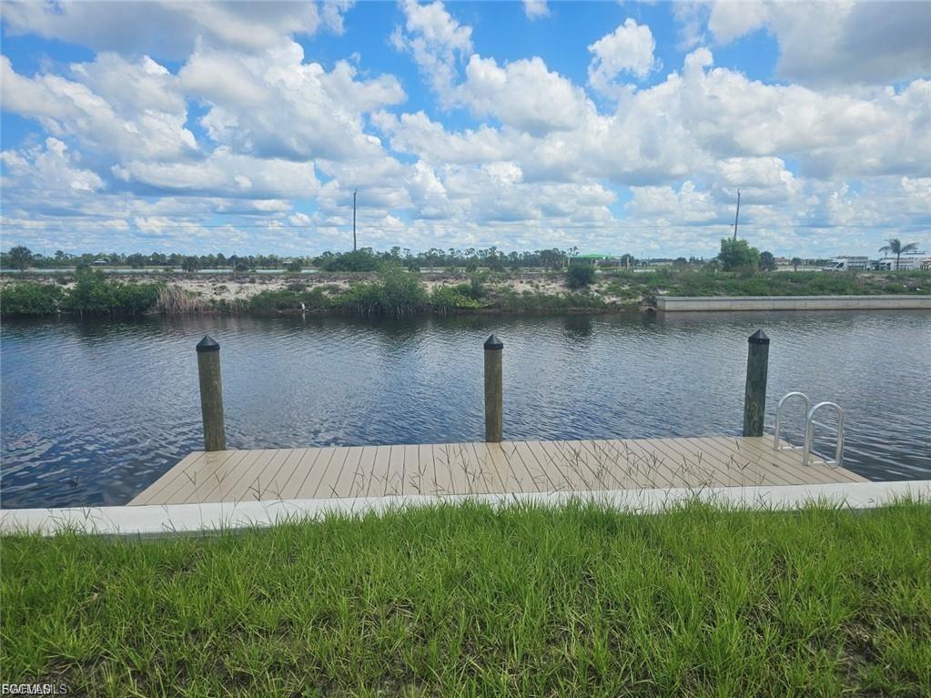 Direct Gulf Access Waterfront Lot – Your Gateway to Paradise! Imagine waking up to shimmering water views and launching your boat from your private dock—this stunning Gulf-access homesite is ready for your dream build, complete with a brand-new seawall and dock already in place. Located in one of Cape Coral’s most exciting growth corridors, you’re just moments from the all-new Crystal Lake Park, featuring boat ramps, kayak launches, a fitness park, and breathtaking sunset vistas from the overlook hill. Boater’s Bliss & Angler’s Paradise With world-class fishing and endless boating adventures right outside your door, this location offers direct access to the Gulf of Mexico and nearby islands. Whether you're cruising to waterfront restaurants or exploring hidden beaches, the lifestyle here is second to none. Surrounded by Southwest Florida’s Best Enjoy quick access to shopping, dining, resorts, airports, and the region’s most beautiful beaches. Cape Coral boasts more canals than any city on Earth and is the largest city in SWFL—making it a top destination for tropical living and smart investing. Ready to Build with Top Local Builders New construction is booming in the area, and you’ll have your pick of trusted builders to bring your vision to life. Whether you're designing a luxury retreat or a cozy coastal cottage, this lot is your blank canvas. Fall in Love. Make the Move. Live the Dream. This isn’t just land—it’s a lifestyle. Come experience the magic of waterfront living in Cape Coral and claim your piece of paradise today.