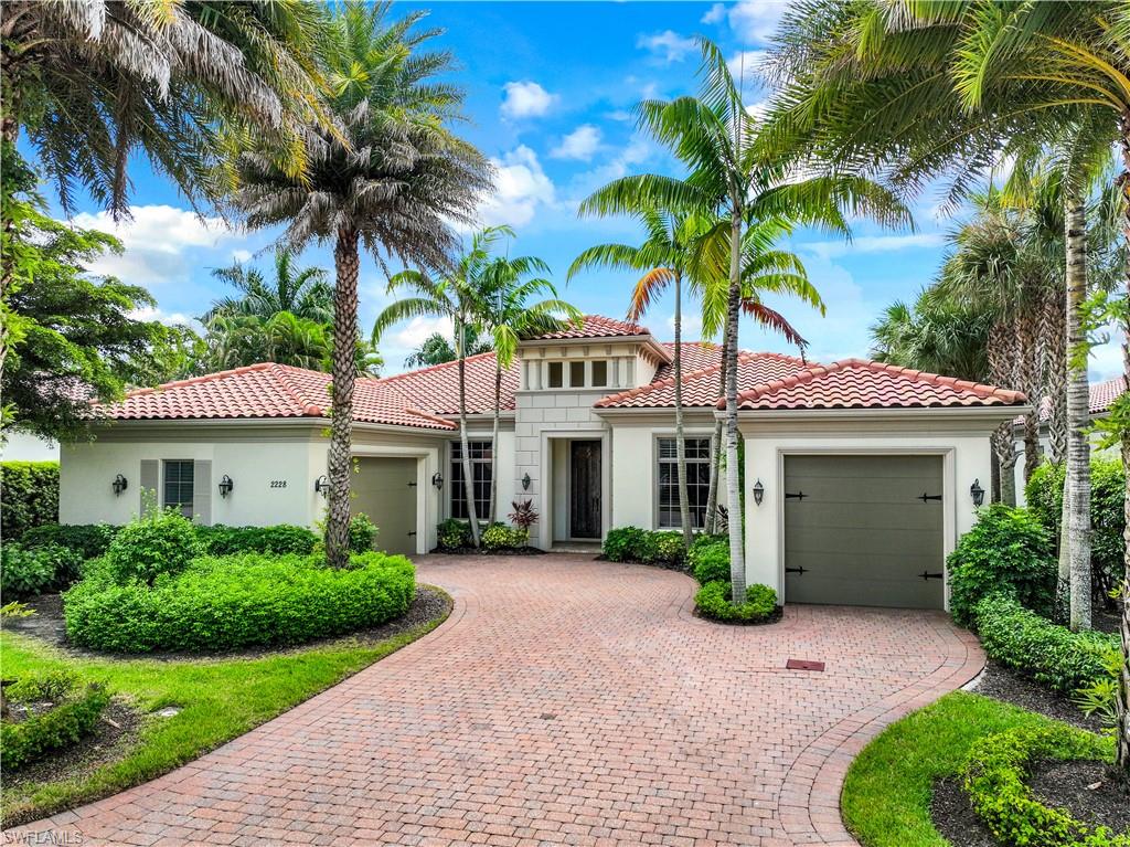 Welcome to one of Naples most established and prestigious communities for active, healthy living...Grey Oaks.  This stunning home is situated in Miramonte surrounded by lush palm trees, beautiful landscaping and a long lake view.  As you enter the home, you will be delighted by the stylish finishes, neutral pallet, vaulted ceilings, plantation shutters, 3 car air-conditioned garage and 3 en suite bedrooms. Enjoy the indoor/outdoor living as the kitchen and family room open up to the large outdoor living room. The outdoor area has a covered entertainment area and outdoor kitchen.
Exclusive social opportunities, three championship golf courses 30,000 square foot state-of-the-art wellness center, three exceptional dining venues, two clubhouses, tennis, pickleball, bocce, a resort-style pool, and spa.   Welcome home to life to the fullest - a carefully curated, enriched lifestyle filled with warmth, fun, friendship, excitement and adventure.
