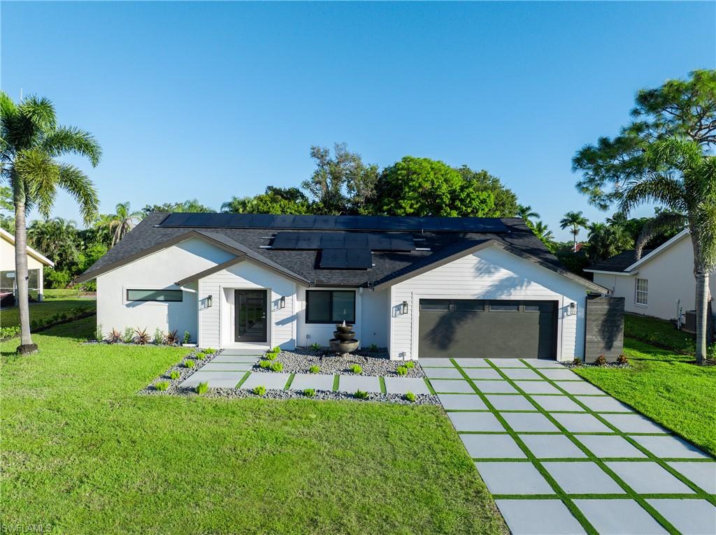 Welcome to 5105 Berkeley Drive! This beautifully renovated home has been completely updated from top to bottom with high-quality finishes and major structural improvements, making it truly move-in ready.

Interior upgrades include new framing, insulation, drywall, porcelain wood-look tile flooring throughout, solid-core interior doors, updated baseboards, all-new PEX plumbing and drain lines, and a stunning living room fireplace. The redesigned kitchen features custom cabinetry, quartz and porcelain countertops, new hardware, and brand-new kitchen and laundry appliances.

Major exterior improvements include a new shingle roof, gutters, fascia, fresh stucco, hurricane-impact windows and doors, a high-efficiency HVAC system, FULLY PAID OFF SOLAR PANELS, a new insulated garage door, and an epoxy-coated garage floor.  Garage is also wired for a mini-split to cool down the garage area.

Outdoor living is equally impressive with a newly screened no-see-um lanai, a full pool bath finished with Taj Mahal granite, a sparkling pool with a sealed marble deck and glass waterline tile, lanai is also plumbed and ready for new outdoor appliances.  There is also a custom fire pit area—perfect for relaxing or entertaining. Professional landscaping, a new irrigation system, a redesigned driveway, a three-tier fountain, and a comprehensive security system complete the property.

Located in a community with very, very LOW HOA FEES!!!!  This meticulously updated home offers the perfect combination of luxury, efficiency, and peace of mind. Every major improvement has already been completed—simply move in and enjoy Florida living at its finest.