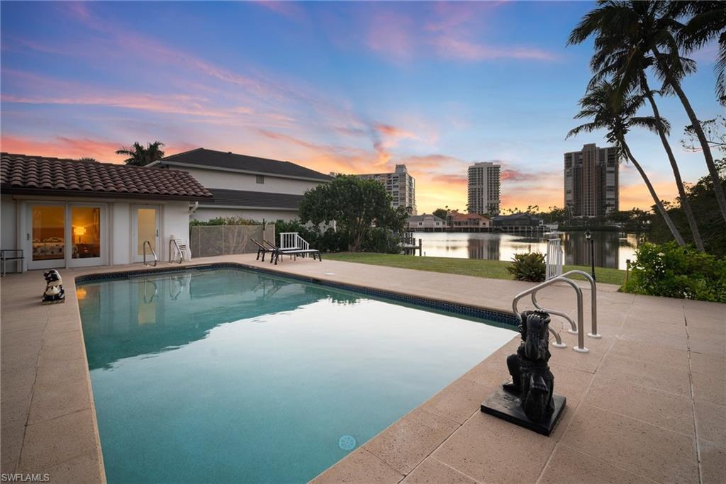 INCREDIBLE OPPORTUNITY PRICED AS LAND VALUE!! Nestled on a peaceful cul-de-sac in the coveted neighborhood of Park Shore, this stunning property offers 2,758 square feet of endless potential on a sprawling .64 ACRE LOT. This Gulf-accessible property features one of the largest, WIDE WATER VIEWS of Venetian Bay, presenting a rare opportunity to live the ultimate waterfront lifestyle. The existing 4-bedroom, 4-bathroom residence features impact glass, roll-down shutters, and a private pool, providing a solid foundation for your dream remodel. Alternatively, envision building a custom-designed, new construction masterpiece to take full advantage of the Western rear exposure and breathtaking sunsets. With NO FLOODING from recent hurricanes, this property is as secure as it is stunning. Located just moments from Seagate Beach and Park Shore's private beach access, you'll enjoy unparalleled convenience to Naples' finest amenities, including Waterside Shops, Venetian Village, and more.