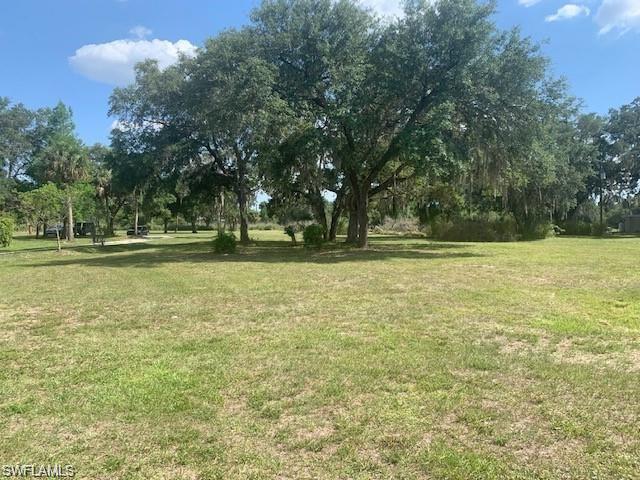 Opportunity awaits. This 2-acre property is for sale on Highway 80 with prime road frontage! The front acre is zoned commercial, offering great business potential, while the remaining acreage is residential—perfect for a live/work setup or future development. Thousands of cars pass by daily, giving you excellent visibility. Conveniently located just a short commute to Fort Myers. Great opportunity in a growing area! Seller will entertain all offers.