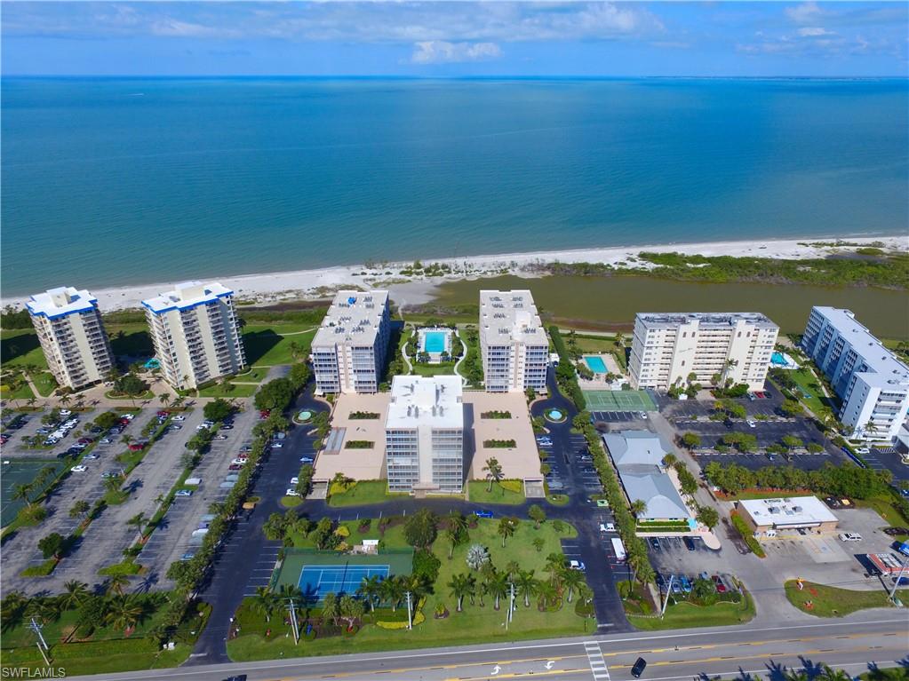 C.16290 - Corner unit on the 6th floor with Great views! Wrap around balcony with sliding doors. Open tiled kitchen with breakfast bar. Turnkey furnished. The furniture is newer with coastal flair. Under building parking. A/C was put in in 2016 and hot water heater 2013. Very nice clean residence. Creciente is located right across from the shopping center Santini Marina Plaza. Large pool with activities every week during the season. Exercise room, tennis and so much more. 1 year home warranty included valued at 995.00 on all appliances and plumbing with Home Tech.