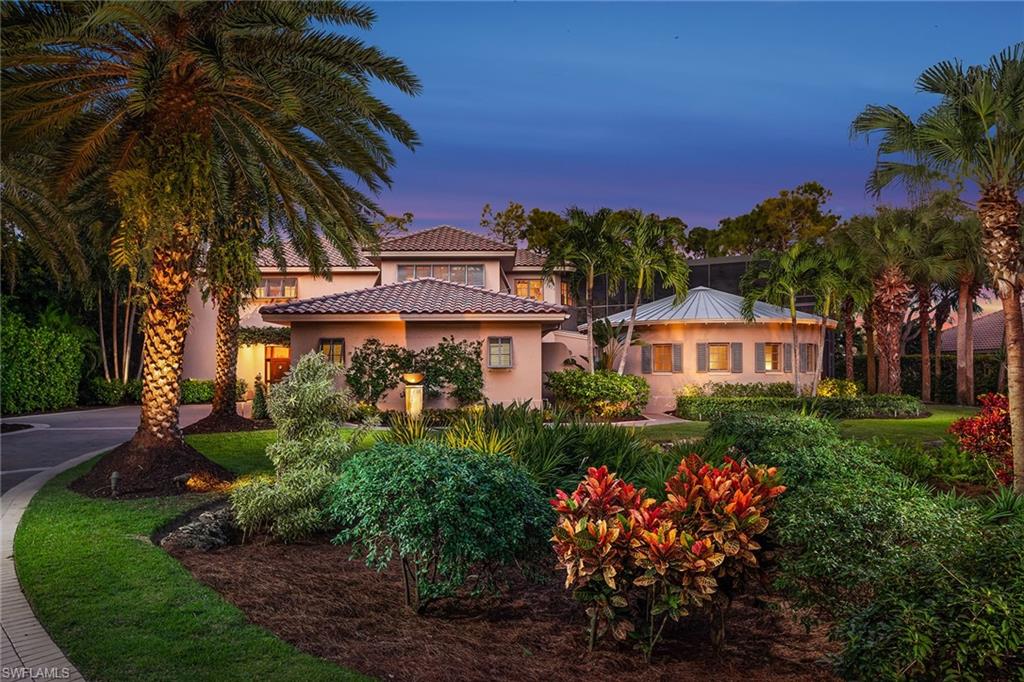 “Radial House” is a unique work of architecture whose design flows in connection with Nature’s beautiful surroundings. With the 180-degree sweep of its radial veranda, the house captures views of the Pine course fairway, lake, bougainvillea, pines, palms and sunsets. This sweep completes itself with a very spacious lanai, organically shaped pool and Jamaican-style circular guest house. The interior of the house has an open floor plan allowing for flexible furniture arrangements and the use of space. Curved planes of the architecture also contribute to enhanced structural resistance to severe wind forces. This comfortable home includes all the features one expects with a property of this caliber. Grey Oaks has extraordinary amenities that include a 30,000 square foot wellness center, 3 golf courses, tennis and pickleball courts, bocce ball, two clubhouses, a resort-style pool and the best staff in the world. The community is centrally located in Naples, easily accessible to I 75 and a short drive to the SW Florida International Airport.