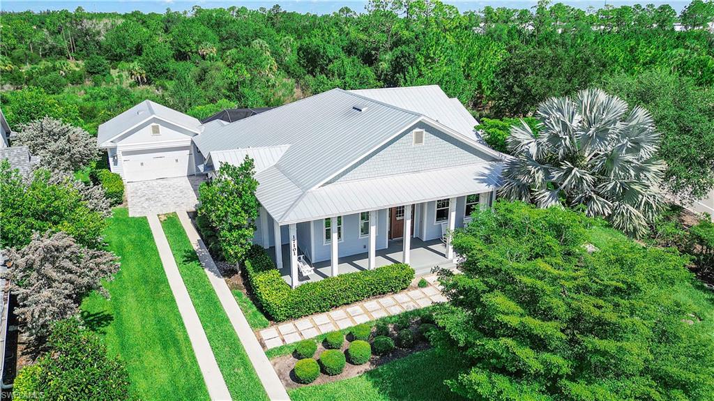 Rarely available Florida Lifestyle Homes The Taylor Model offering 4 bedrooms, 3 full bathrooms, two private ensuite bedrooms, just under 2,800 square feet under air, and breathtaking preserve views in the exclusive Bullhorn Circle enclave of Lake Timber, where only 19 homes enjoy this quiet, sought after setting in Babcock Ranch. Designed for luxury living and effortless entertaining, this exceptional residence showcases a desirable split bedroom floor plan, formal dining room, and an impressive great room with soaring 16 foot wood vaulted ceilings accented by stunning stained wood beams. The gourmet kitchen is the heart of the home featuring Cambria quartz countertops, a farmhouse sink, premium wood and glass cabinetry, Bosch stainless steel range hood, gourmet appliances, and a spacious walk in pantry. The oversized laundry room includes built in cabinetry and a utility sink for added convenience. The luxurious primary suite is a private retreat with direct access to the screened lanai, dual walk in closets, and a spa inspired bathroom complete with a soaking tub, frameless glass enclosed shower, and dual vanities. A second private ensuite bedroom provides the perfect space for guests or multigenerational living while the additional bedrooms offer flexibility for family or a home office. Outdoor living is equally impressive with a wrap around front porch and an expansive screened lanai featuring an outdoor kitchen, storm screen, and peaceful preserve views that create the perfect backdrop for relaxing or entertaining year round. Additional upgrades include impact resistant windows and doors, a reverse osmosis water system, a new HVAC system installed in 2025, detached oversized two car garage with epoxy flooring.  Located in Flood Zone X, flood insurance is not required, and many homeowners benefit from lower insurance costs thanks to Babcock Ranch's innovative planning, underground utilities, storm resilient infrastructure, and impact resistant construction. Enjoy resort style amenities, miles of walking and biking trails, parks, lakes, Food Truck Fridays, live music, the weekly farmers market, and close proximity to B Street, Babcock Ranch's newest destination for dining, shopping, entertainment, wellness, and more. Combining timeless craftsmanship, luxury finishes, exceptional privacy, and one of the community's most desirable locations, this one of a kind Florida Lifestyle Homes residence offers the very best of Southwest Florida living.