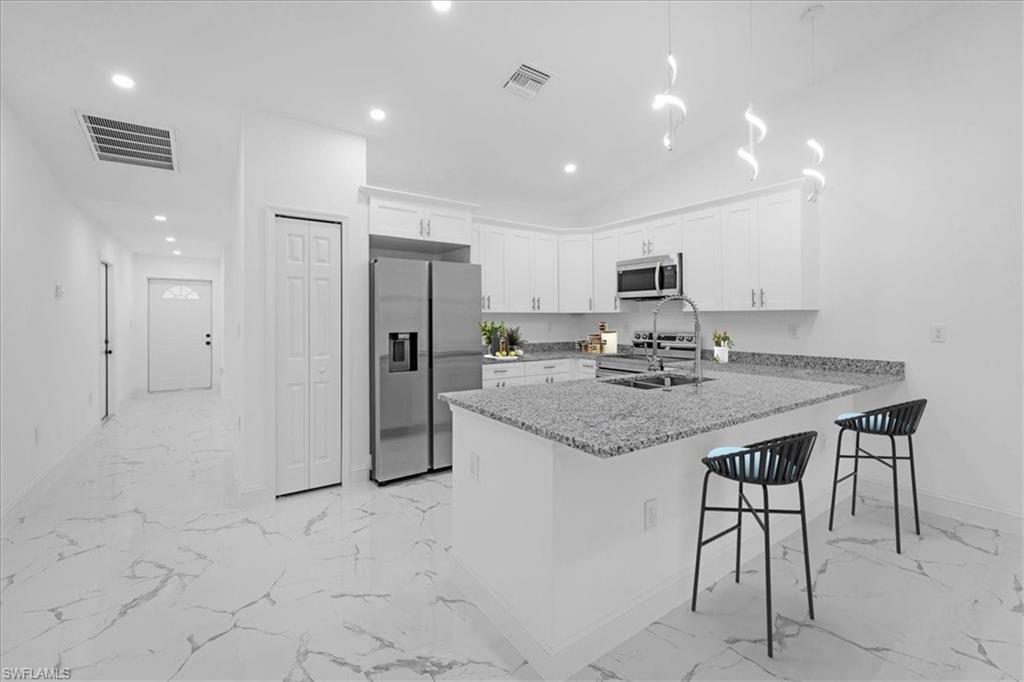 Become the fortunate owner of this excellent source of income property and take advantage of the easier pre-qualification with one of our preferred lenders offering closing costs and down payment assistance. Unique building design of six bedrooms and four bathrooms total. 24x24 porcelain tile throughout, granite or quartz countertops, stainless steel appliances, modern light fixtures, frameless glass shower door in master bath. It offers tub and shower combo, led lights, designer wood cabinetry, security system with cameras, sprinkler system, breathtaking property for sure. Located in one of the best areas of Lehigh Acres, close to shopping centers and main roads. One of the biggest duplex in town on an oversized lot. Just Completed 2024.