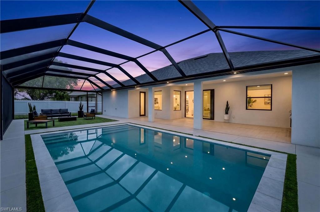 Stunning new construction single-family home located in one of Cape Coral’s most desirable areas. This modern residence sits on an oversized triple lot and features a spacious triple-car garage, offering plenty of room for future projects and expansion. Designed with high-end finishes throughout, this home blends contemporary style with functionality, making it ideal as a primary residence or an income-producing Airbnb. The property offers 4 bedrooms and 3 full bathrooms, highlighted by a spectacular chef’s kitchen with premium cabinetry, elegant finishes, and a built-in bar—perfect for entertaining. The outdoor living area is a true Florida retreat, featuring a covered patio, for year-round enjoyment,  outdoor kitchen, ideal for both summer evenings and cooler nights. This home delivers the ultimate Florida lifestyle. Additional highlights include city water and sewer and not located in a flood zone, providing peace of mind and added .