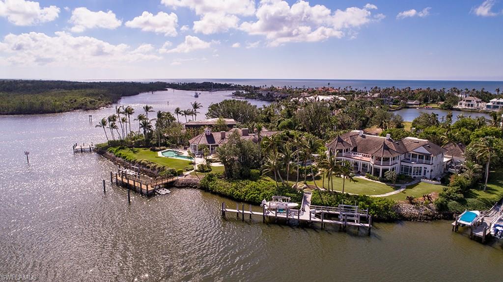 Designed by one of Naples most revered architects, Kasimir Korybut, this home is acclaimed to be one of his finest Port Royal creations. A true work of art, this home is an island-colonial masterpiece originally constructed and recently renovated by A. Vernon Allen Builder, Inc. Perhaps the best docking location in all of Port Royal, it has easily accommodated a sailing vessel of over 100 feet and a number of smaller boats. This timeless estate with its elegant grounds and breathtaking views celebrate your arrival. Refined interiors permit graceful entertaining of any magnitude. A true Port Royal icon. Port Royal Club and Cutlass Cove Beach Club membership eligibility.