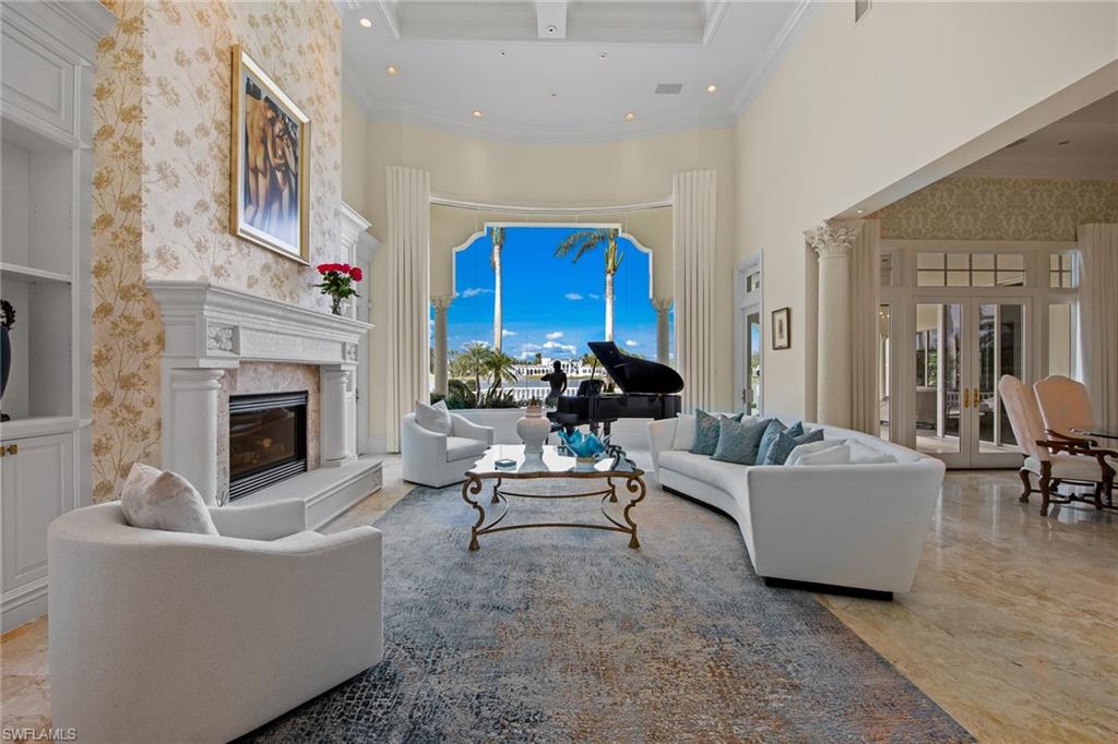 This majestic lakefront estate in Quail West with a TRANSFERABLE GOLF MEMBERSHIP is move in ready with new furnishings and is a showcase of timeless elegance. Brimming with privacy this residence lords almost an acre of land & offers over 6700 sq ft of living space & luxurious upgrades throughout. Pocket sliders 1 of 2 living rooms give away to the 1200 sq. ft. loggia. The coveted indoor/outdoor lifestyle is perfectly encapsulated in this estate's entertainment deck with a gas-heated pool, spa & numerous lounging areas. Additional features include soaring ceilings with exquisite details, wood-paneled executive office/library, marble flooring, 3 spacious ensuite guest rooms, a A/C 3-car plus cart garage, renovated gourmet kitchen with all new stove, microwave, dishwasher & wine cooler. Sprawling master suite houses two sitting areas, his/her closets & baths with a pass-through shower. Upgrades include 5 2019-A/C units, rewired electric panels, Lutron system & Sonos throughout, 2019-whole house generator, 2 propane tanks, newly painted interior/exterior, newly reconfigured driveway with all new pavers, landscape & new stone tile outdoors. This home has it all and luxury awaits!